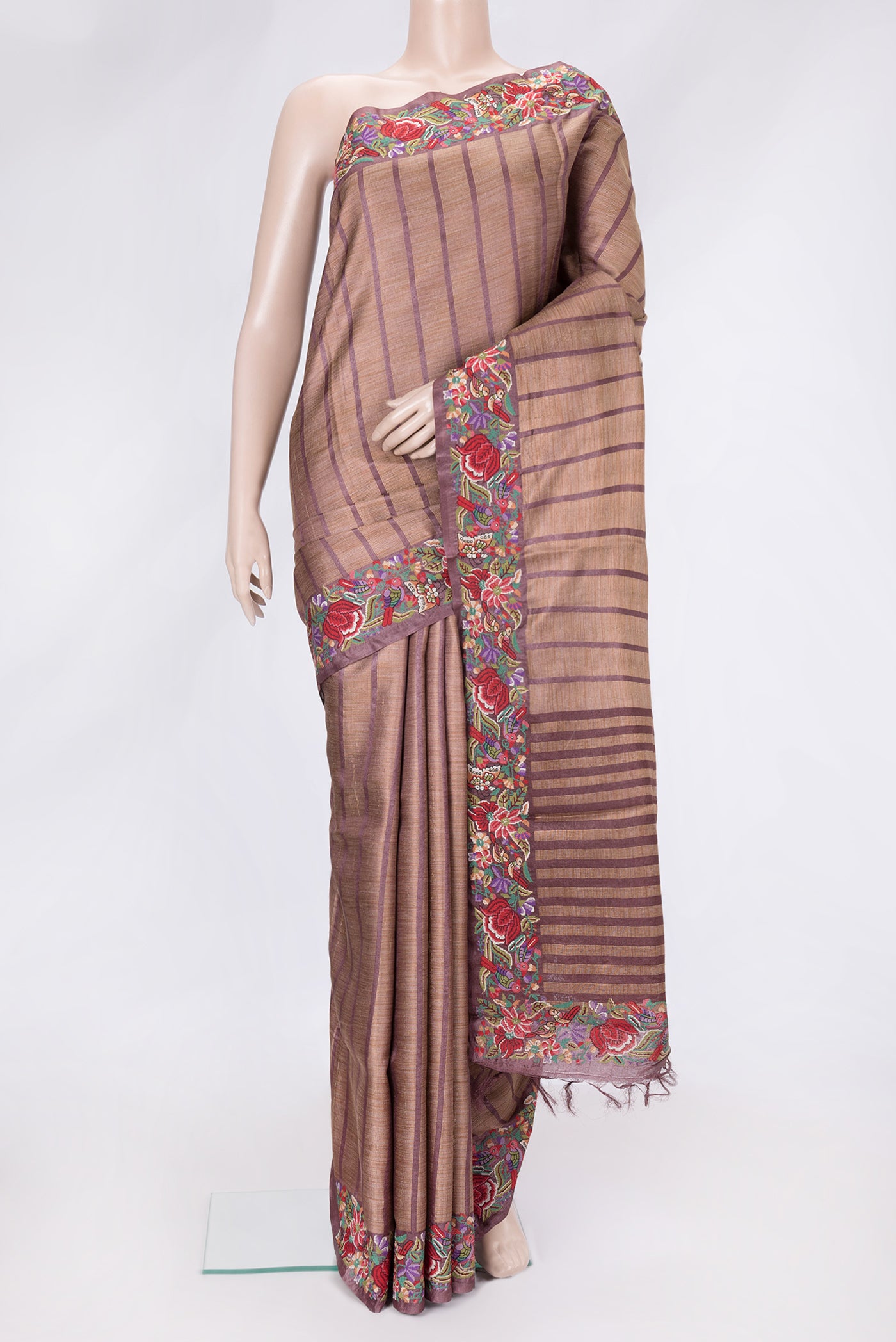 Maroon Dual Tone Tussar Silk Saree with Stripes on the body and Embroidery Border.  displayed on a mannequin