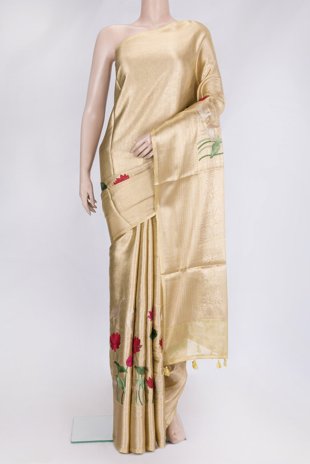 Gold Dual Tone Organza Silk Saree with Zari Brocade on the body and Fancy Border.  displayed on a mannequin