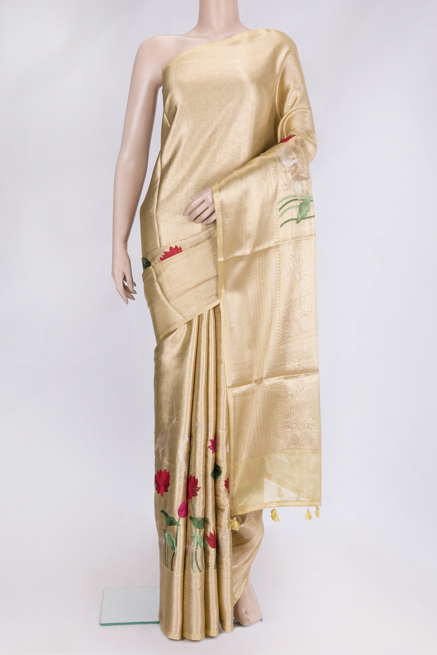Gold Dual Tone Organza Silk Saree with Zari Brocade on the body and Fancy Border.  displayed on a mannequin