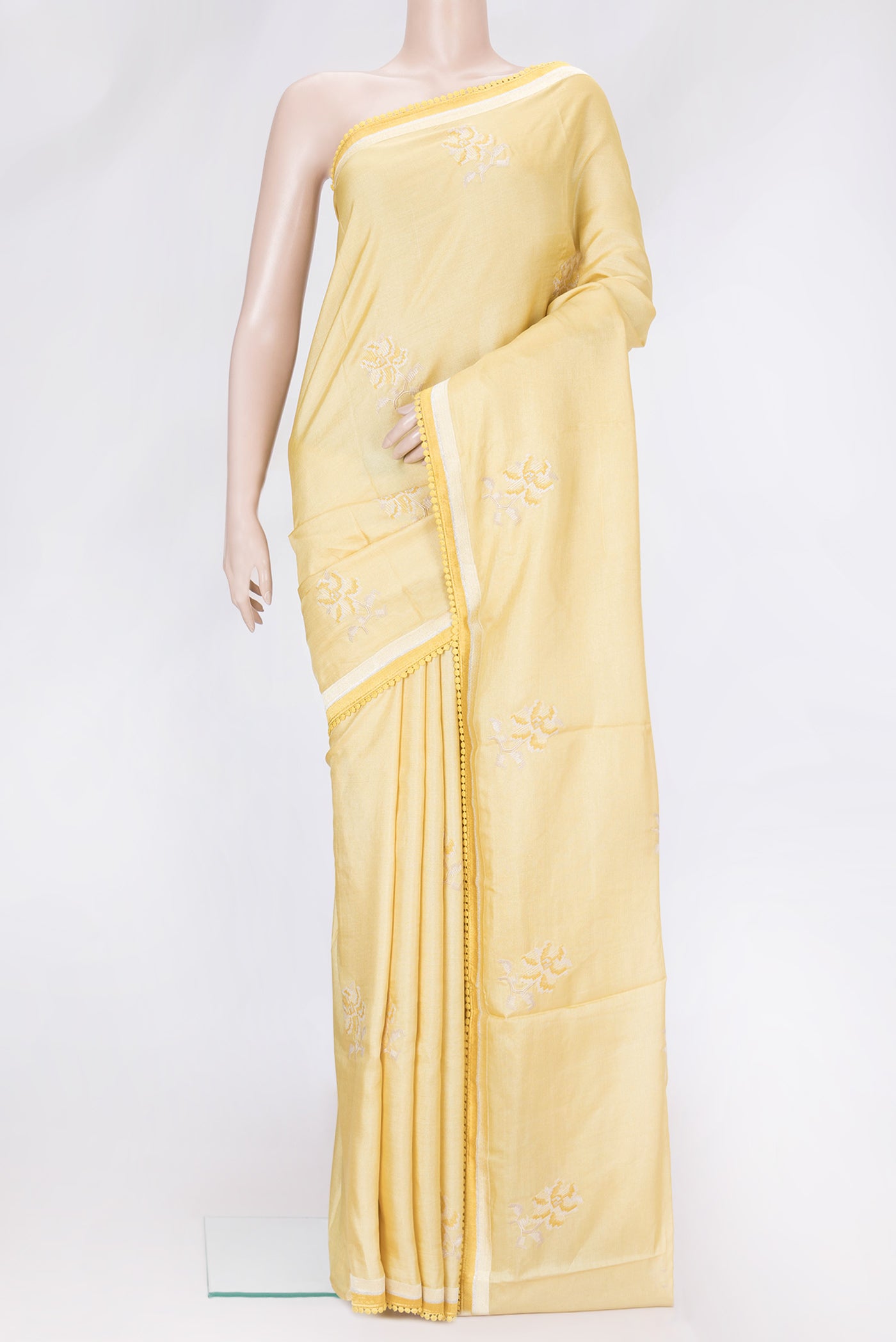 Sandal Dual Tone Tussar Silk Saree with Embroidery on the body and Embroidery Border.  displayed on a mannequin