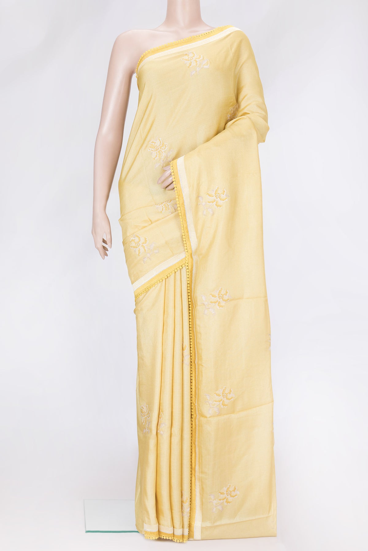 Sandal Dual Tone Tussar Silk Saree with Embroidery on the body and Embroidery Border.  displayed on a mannequin