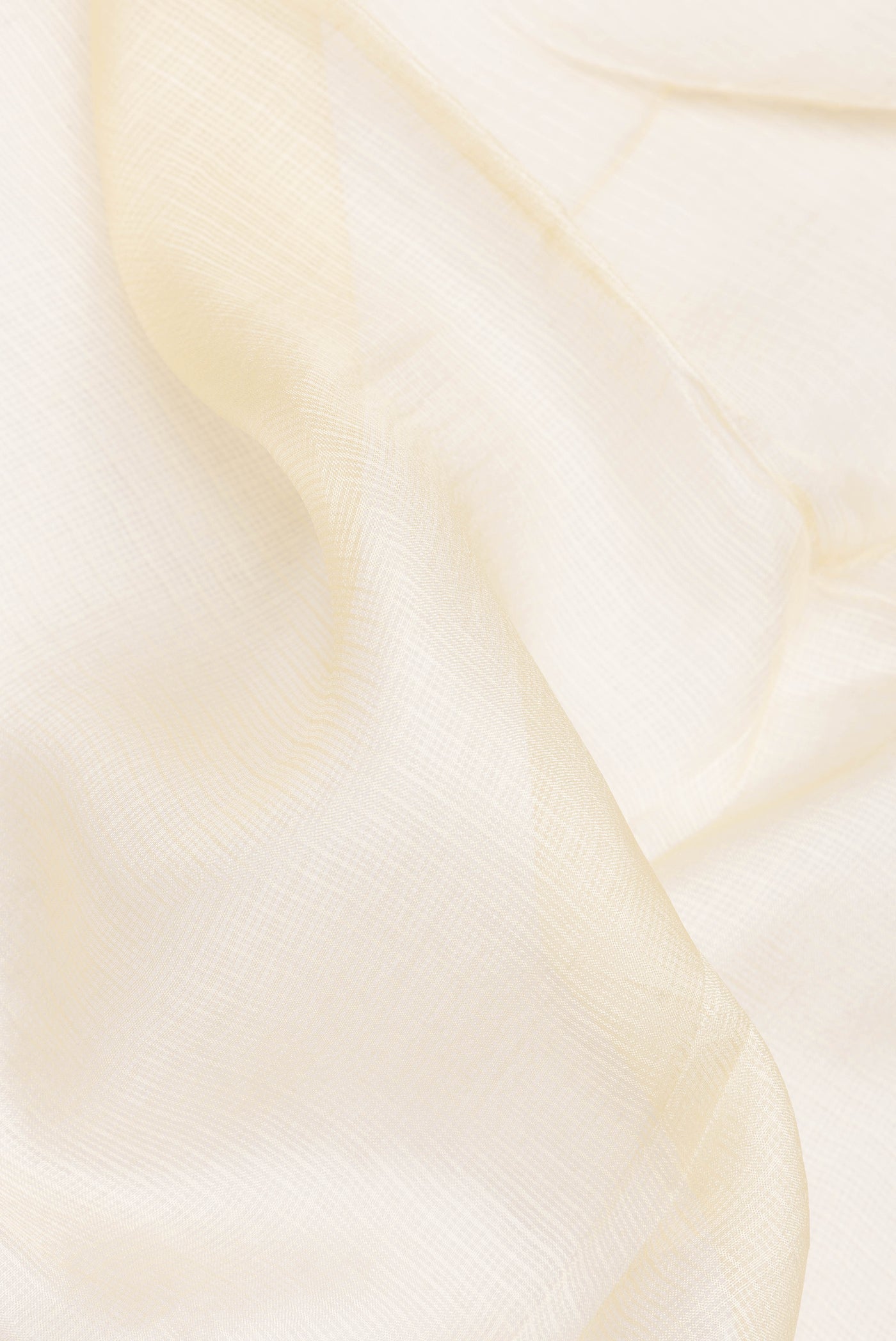 Close up of Beige Dual Tone Kota Silk Saree with Checked design on the body and Embroidery Border.  displaying folds