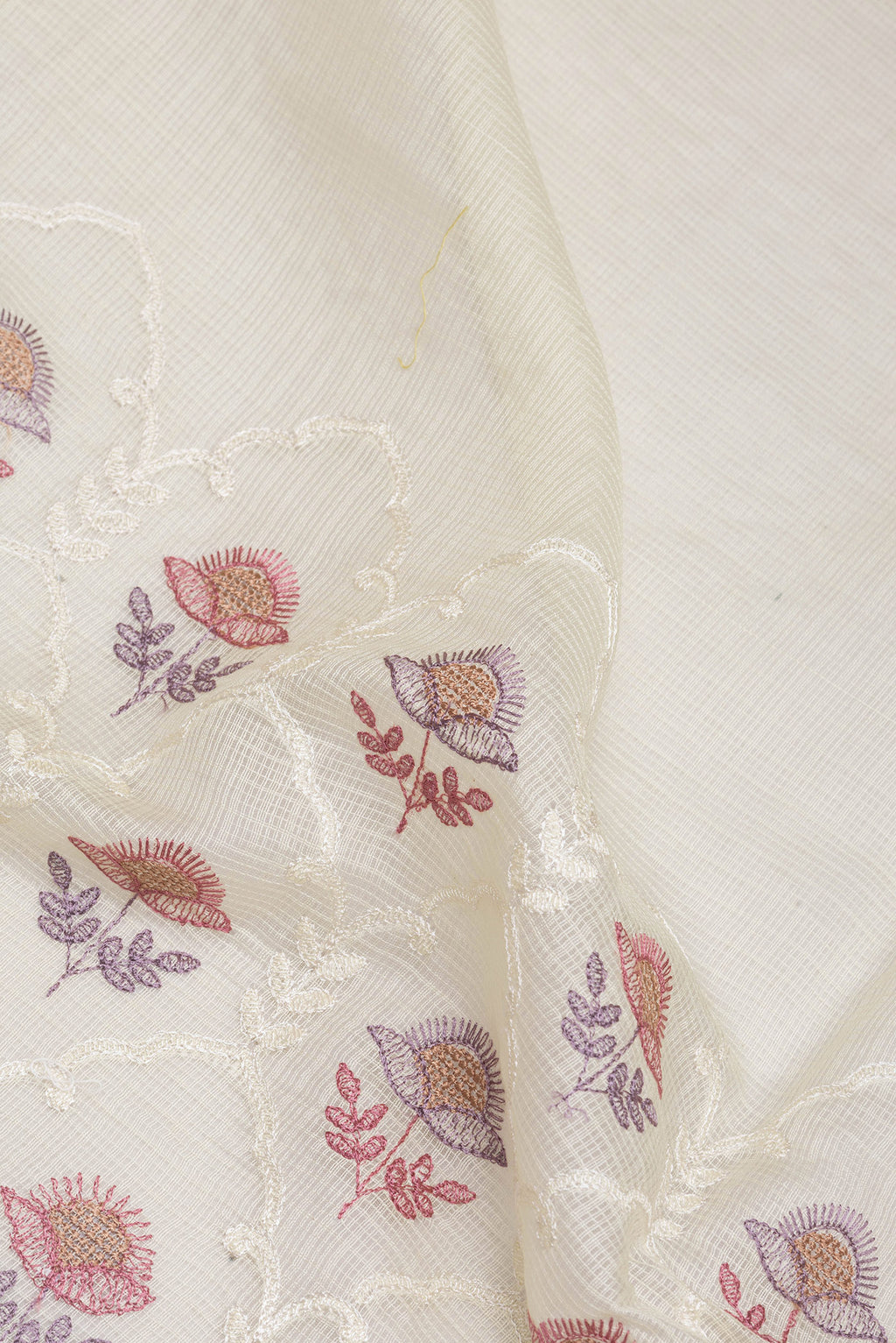 Close up of Off White Kota Silk Saree with Embroidery on the body and Satin Border.  displaying folds