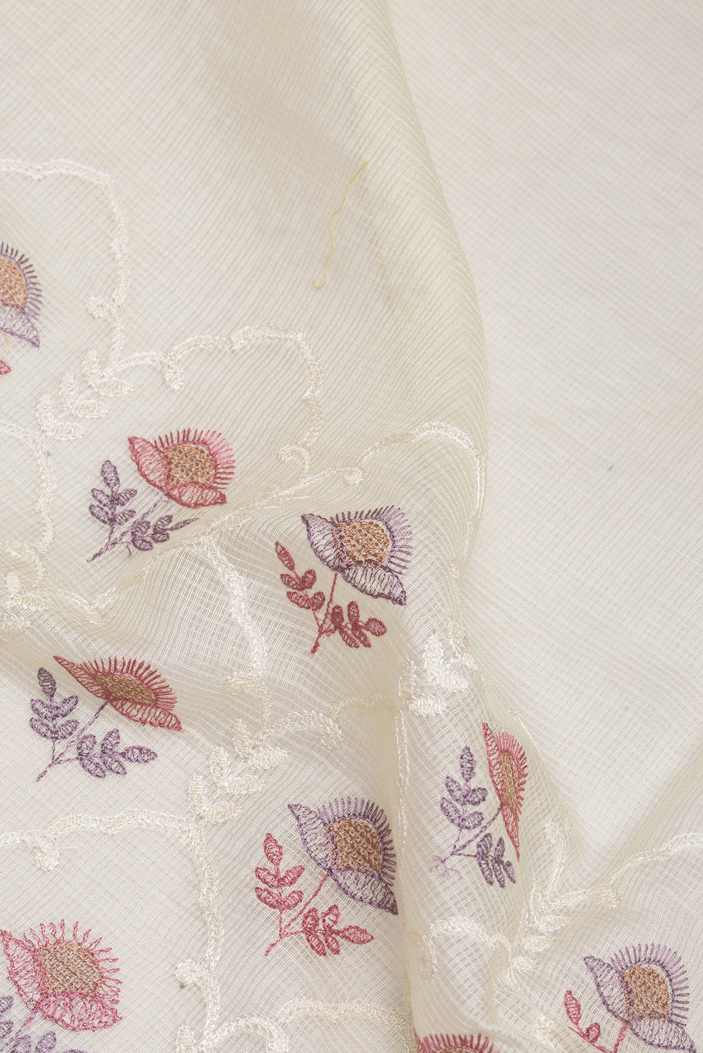 Close up of Off White Kota Silk Saree with Embroidery on the body and Satin Border.  displaying folds