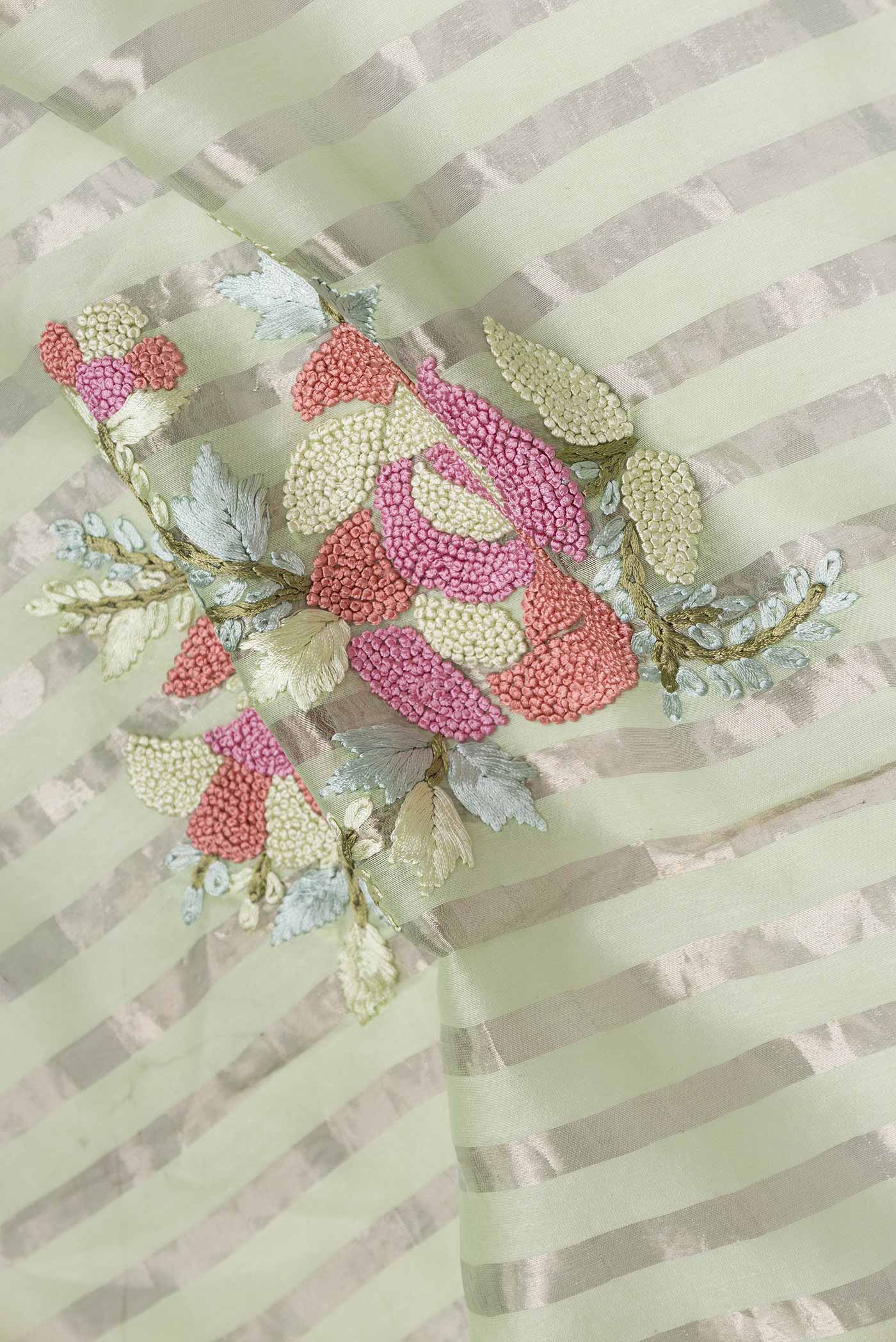 Close up of Pista Green Tussar Silk Saree with Stripes on the body and Embroidery Border displaying folds