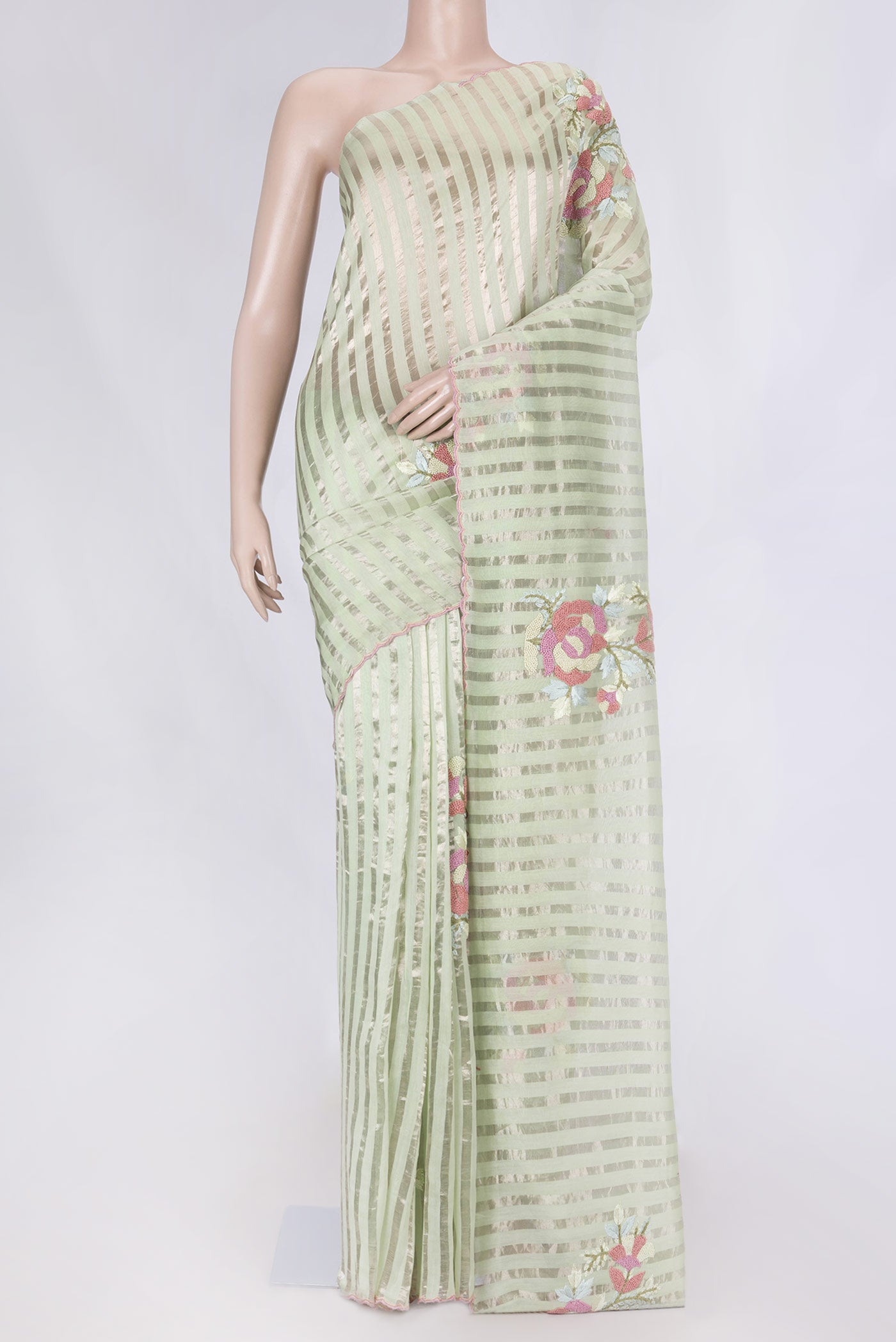 Pista Green Tussar Silk Saree with Stripes on the body and Embroidery Border displayed on a mannequin