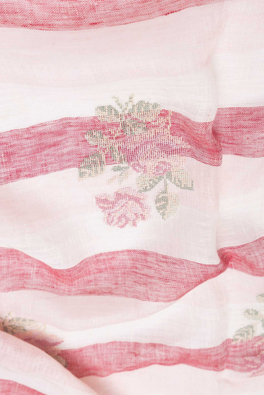 Close up of Beige and Maroon Color Linen Saree with Stripes on the body and Zari Border.  displaying folds