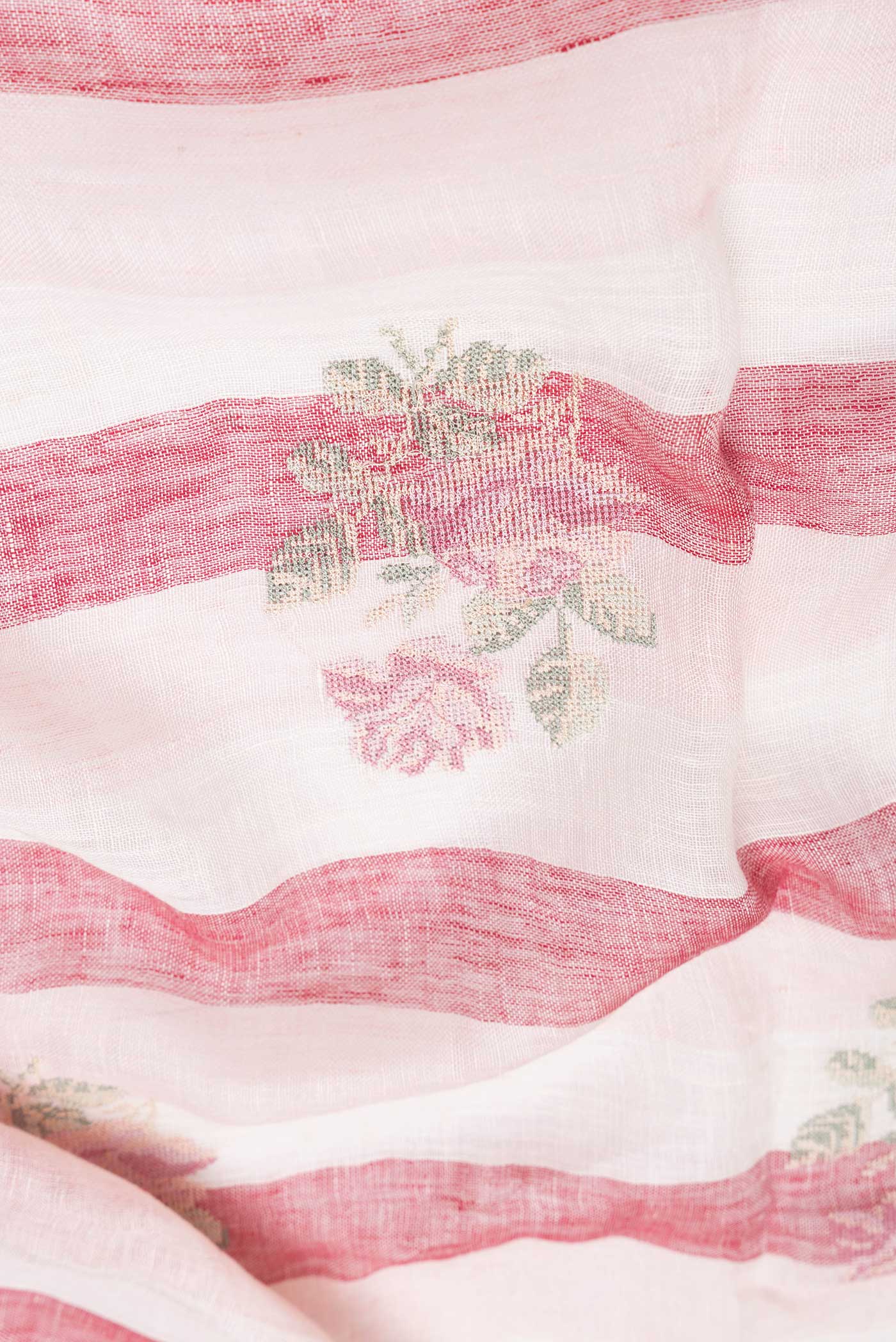 Close up of Beige and Maroon Color Linen Saree with Stripes on the body and Zari Border.  displaying folds