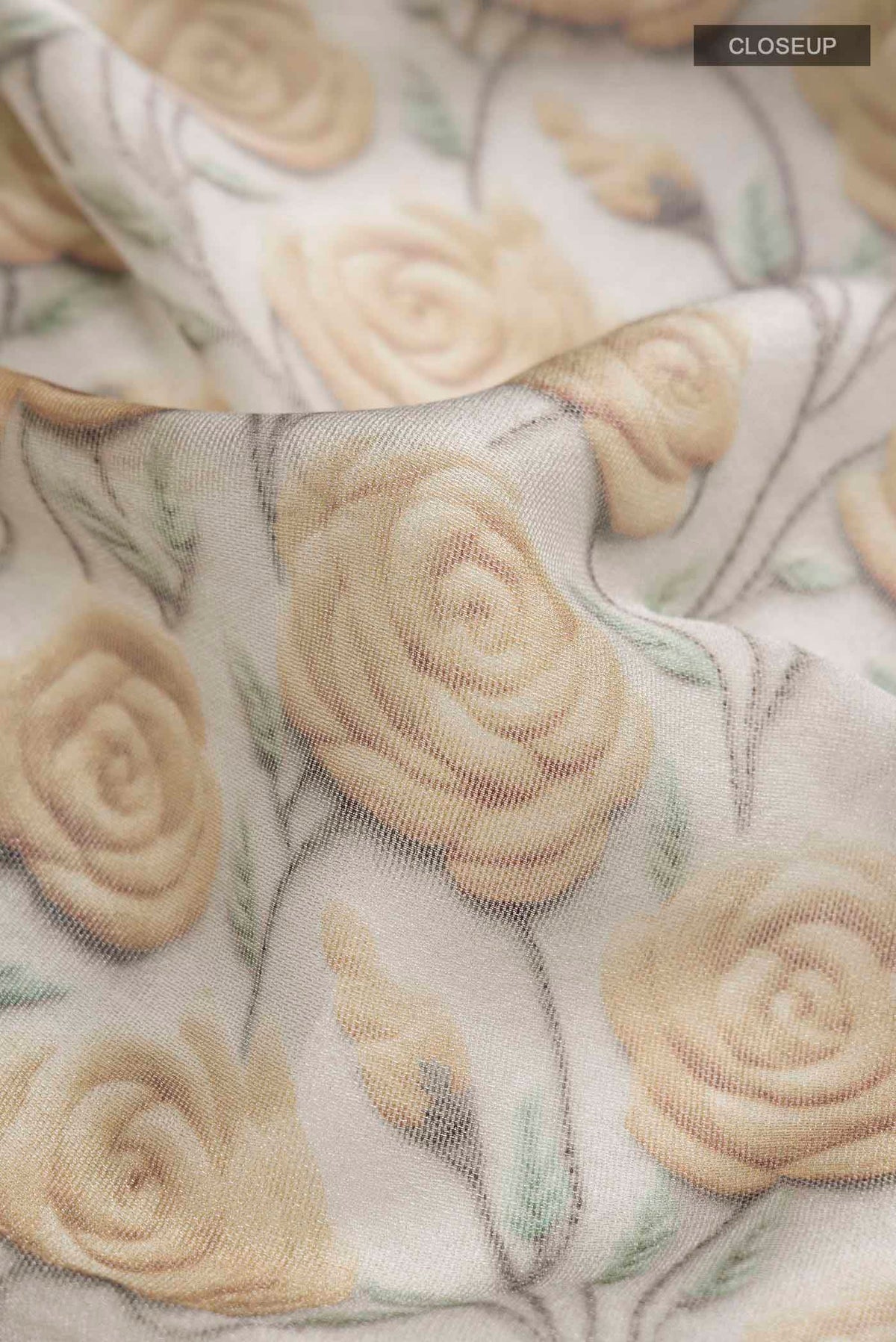 Close up of Grey Tussar Silk SareePrinted design on the body and Embroidery Border displaying folds
