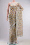 Grey Tussar Silk SareePrinted design on the body and Embroidery Border displayed on a mannequin