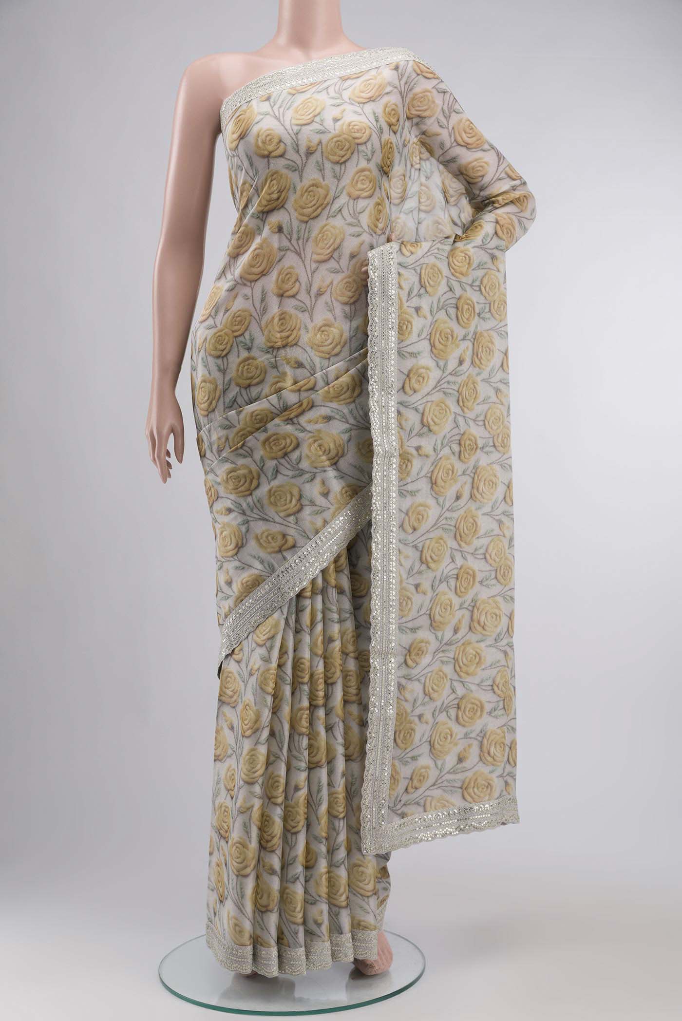 Grey Tussar Silk SareePrinted design on the body and Embroidery Border displayed on a mannequin