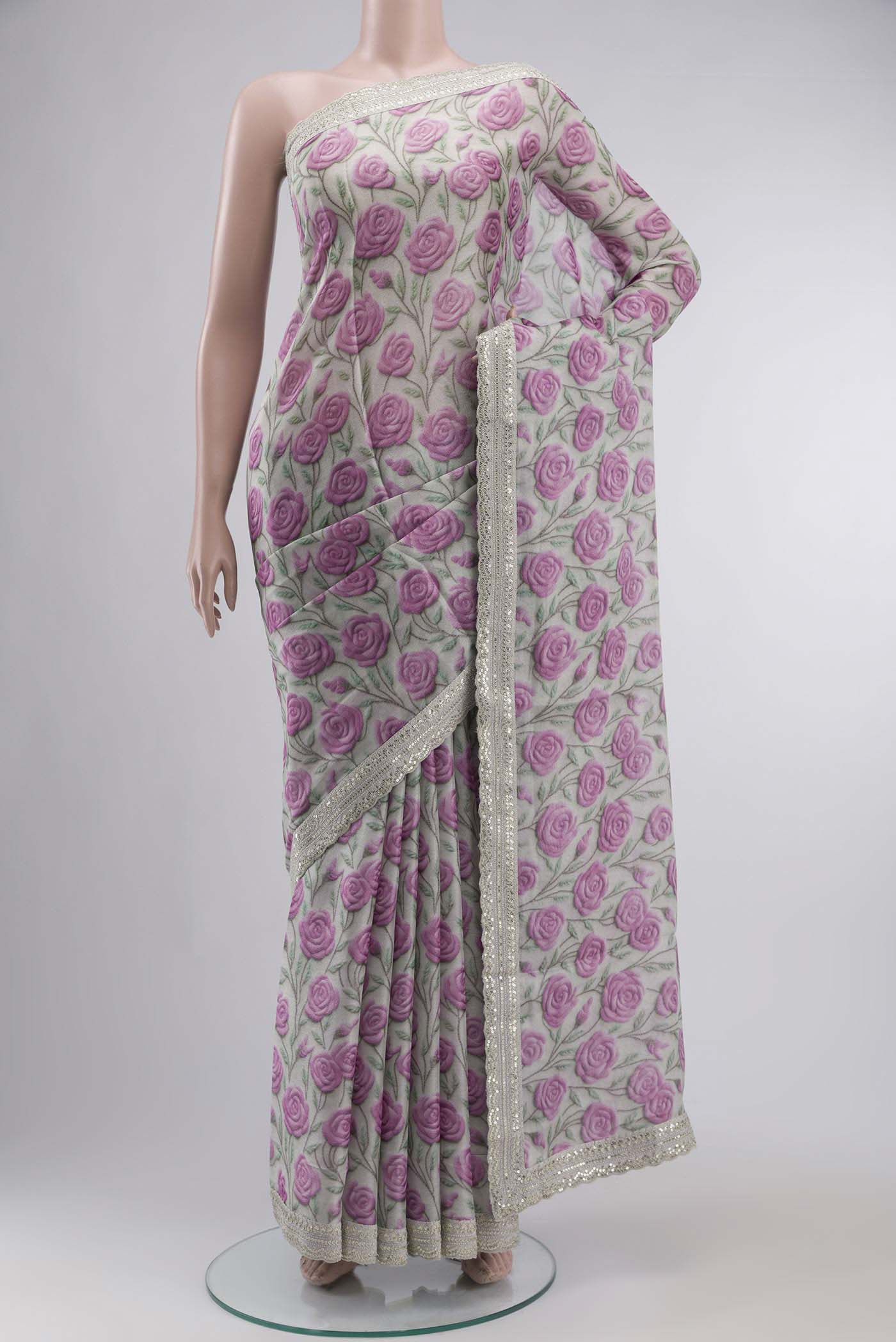 Grey Tussar Silk SareePrinted design on the body and Embroidery Border displayed on a mannequin