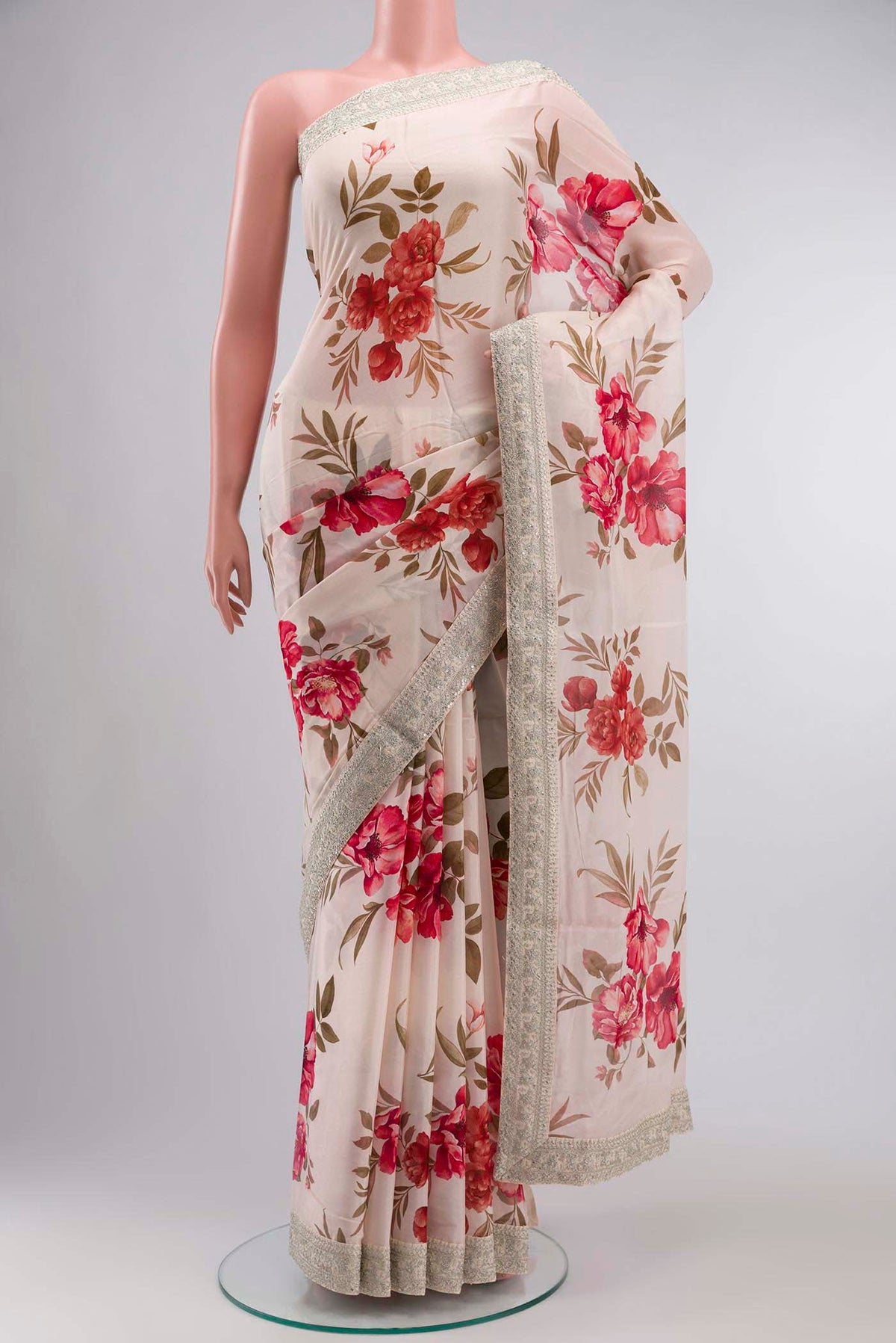 Cream Crepe SareePrinted design on the body and Embroidery Border displayed on a mannequin