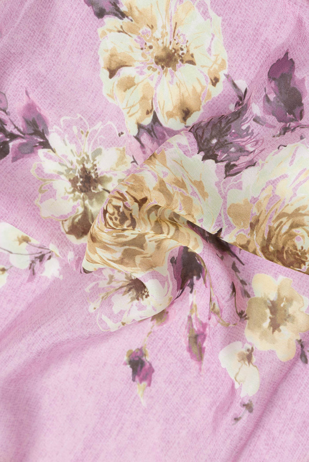 Close up of Pink Dual Tone Mysore Georgette Saree with Printed design on the body and Embroidery Border.  displaying folds