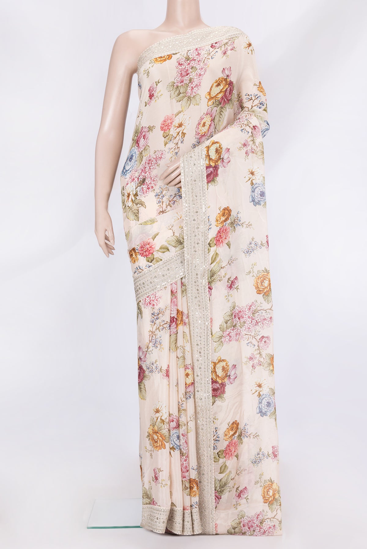 Rose Gold Dual Tone Mysore Crepe Saree with Printed design on the body and Embroidery Border.  displayed on a mannequin