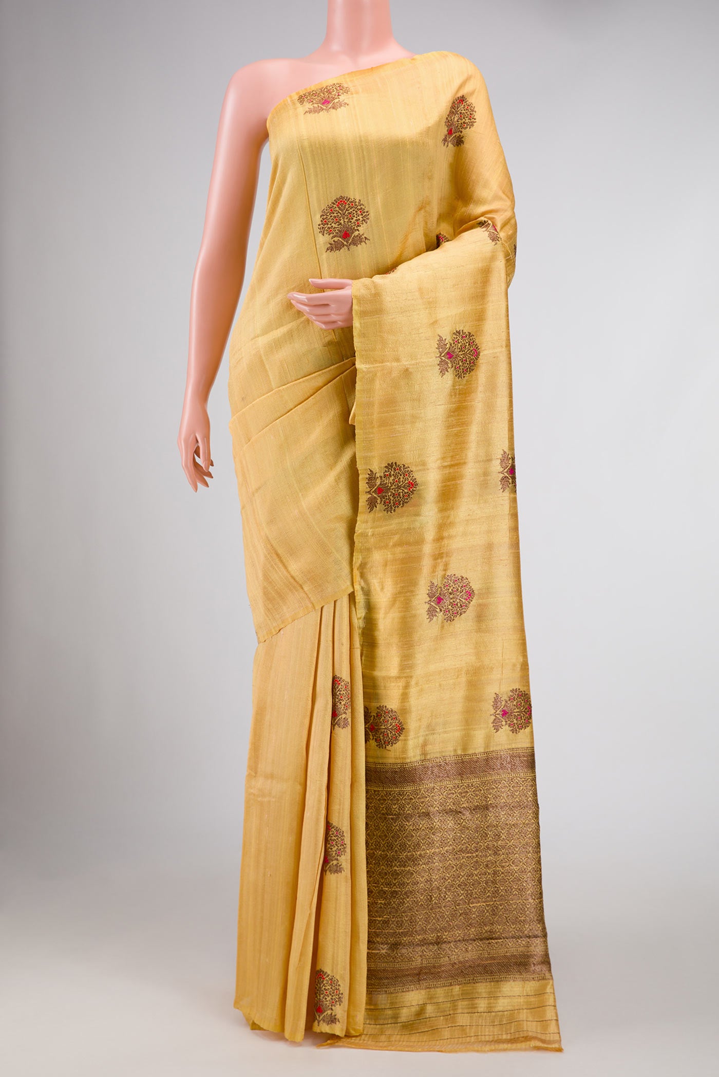 Sandal Banarasi Tussar Silk Saree with Zari And Thread Butta on the body and Without Border displayed on a mannequin