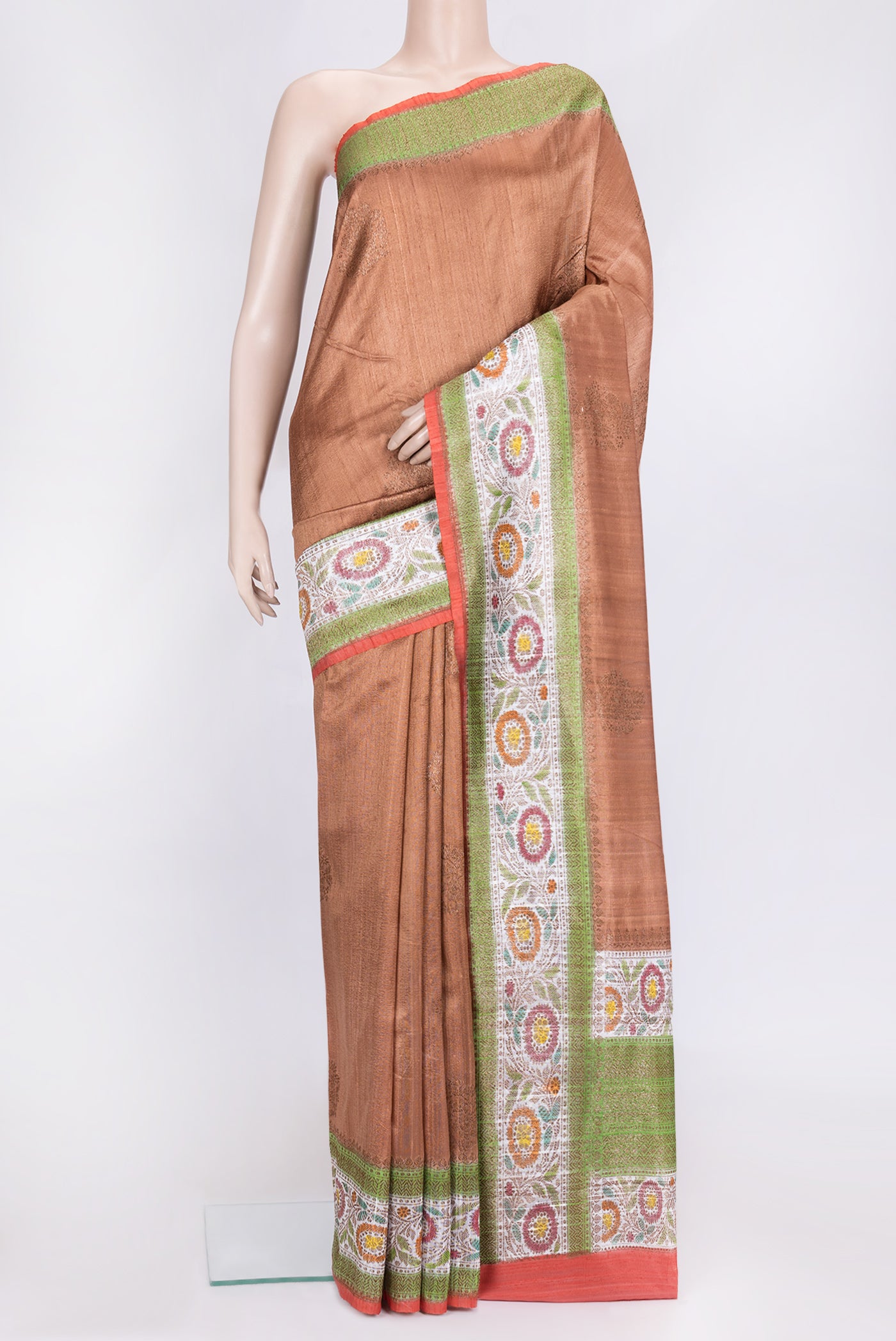 Brown Dual Tone Raw Silk Saree with Zari Butta on the body and Zari Border.  displayed on a mannequin