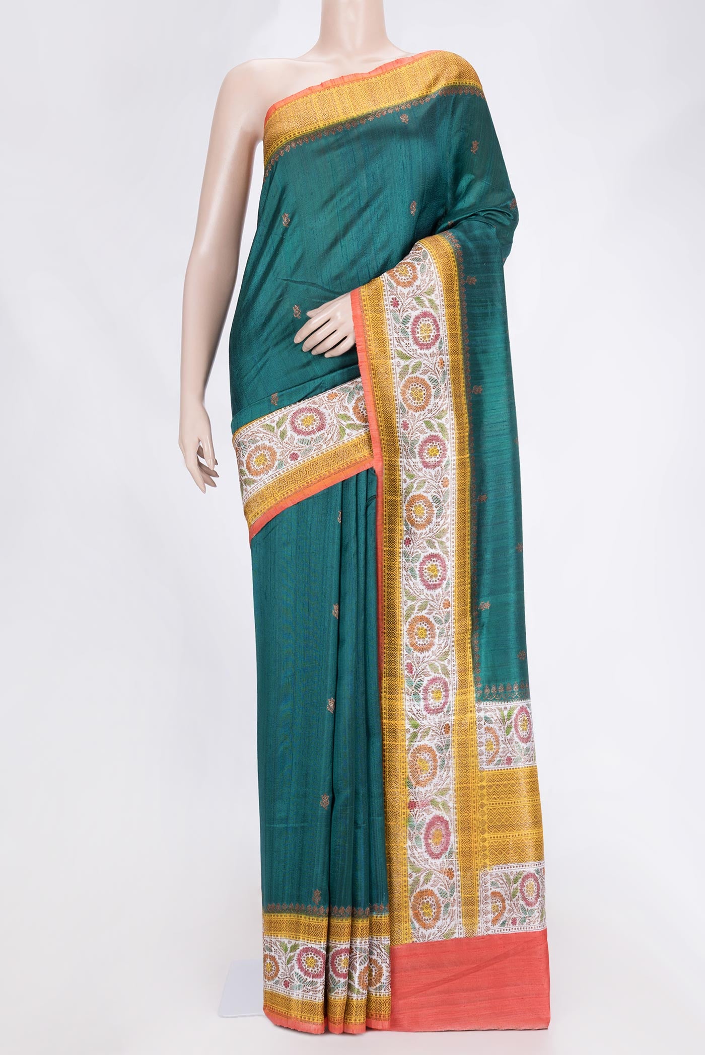 Green Dual Tone Tussar Saree with Zari Butta on the body and Zari And Thread Border.  displayed on a mannequin