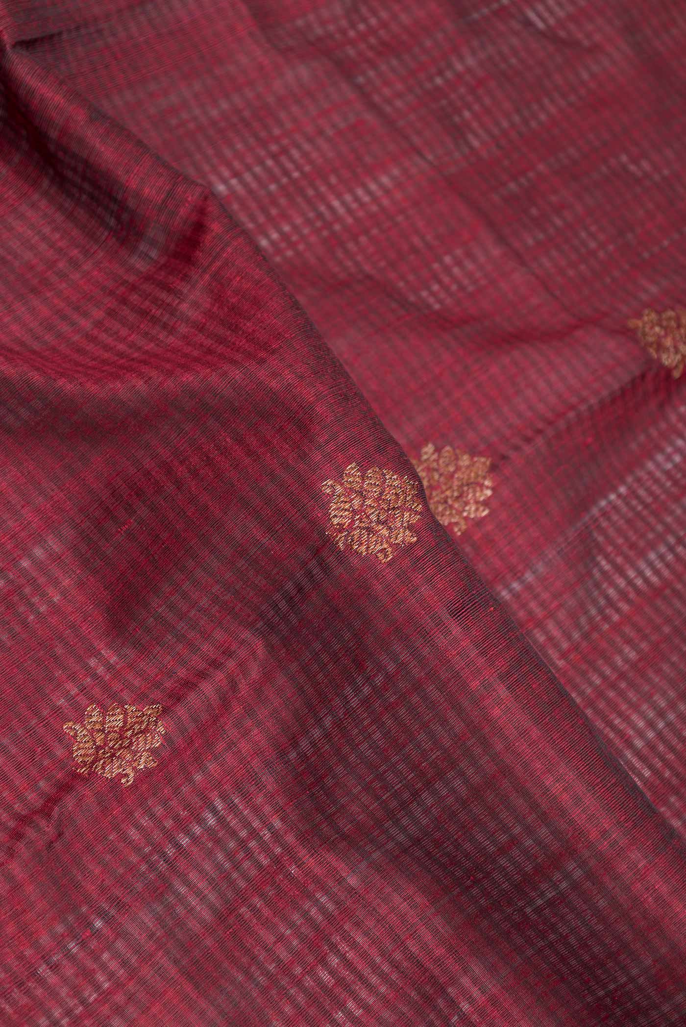 Close up of Deep Red Dual Tone Banarasi Silk Saree with Zari Butta on the body and Zari Border displaying folds