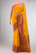 Yellow Banarasi Tussar Silk Saree with Zari And Thread Butta on the body and Zari Border displayed on a mannequin