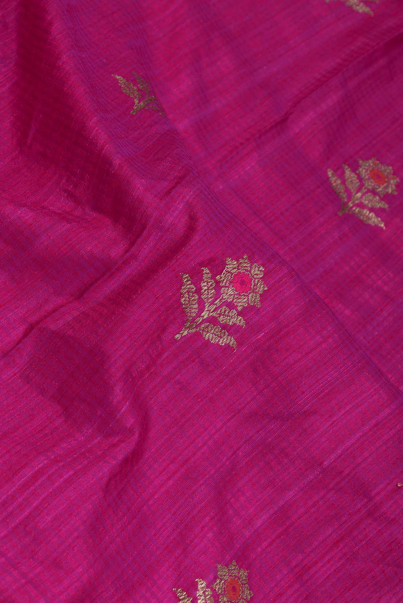 Close up of Pink Dual Tone Raw Silk Saree with Zari Butta on the body and Zari Border displaying folds