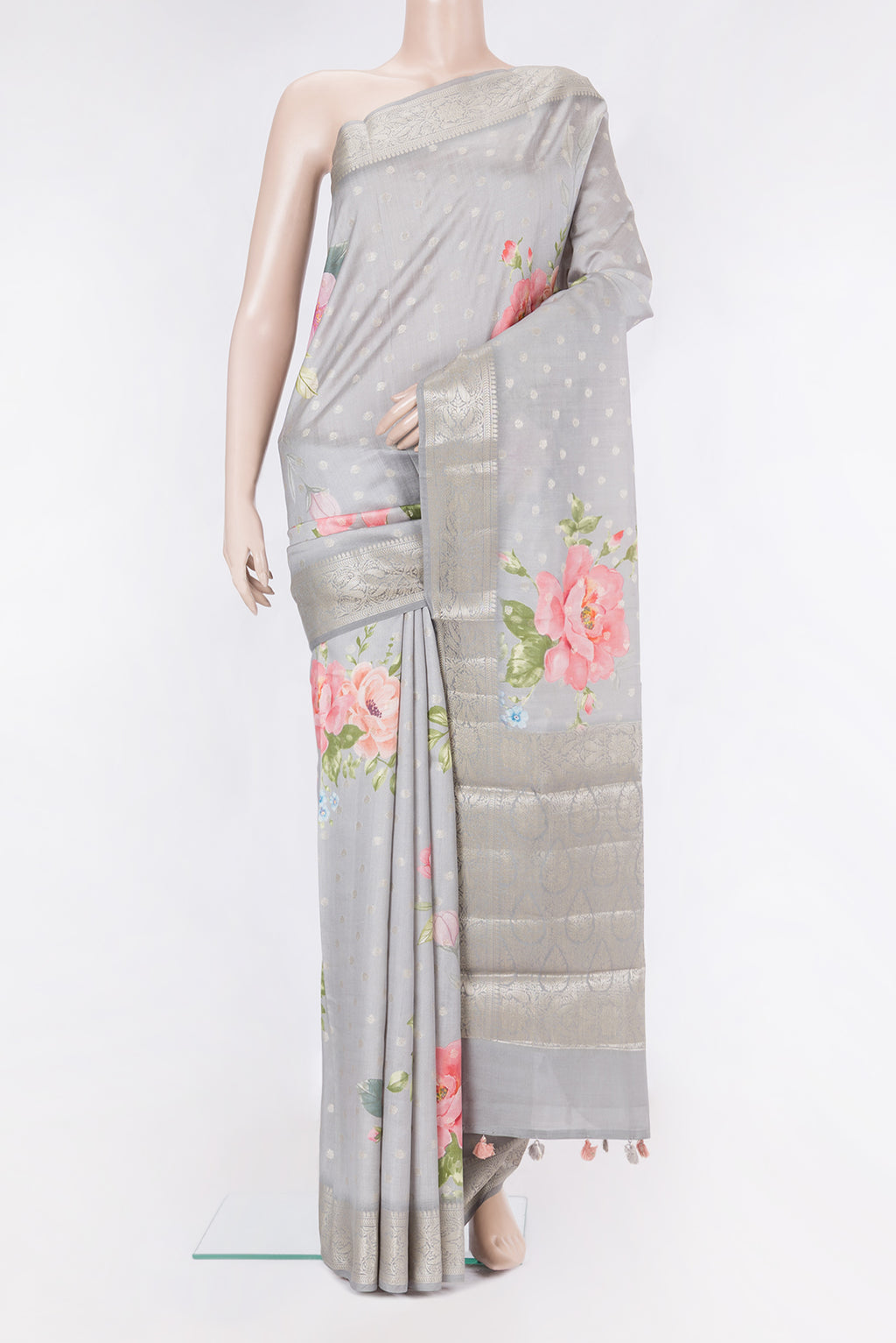 Grey Tussar Silk Saree with Zari Butta on the body and Zari Border.  displayed on a mannequin
