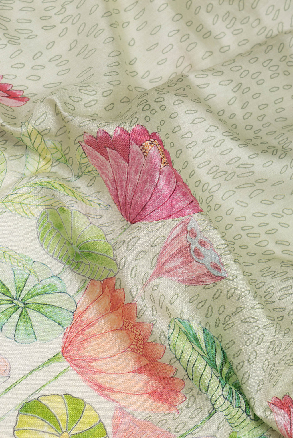 Close up of Light Green Chanderi Silk Saree with Printed design on the body and Zari Border.  displaying folds