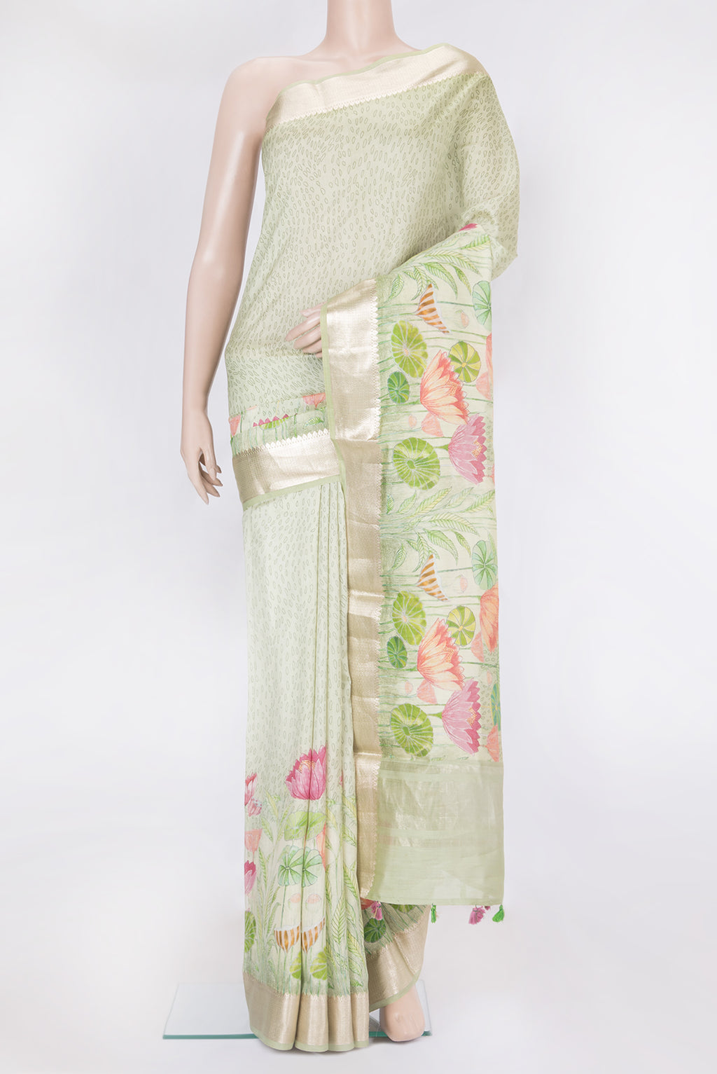 Light Green Chanderi Silk Saree with Printed design on the body and Zari Border.  displayed on a mannequin