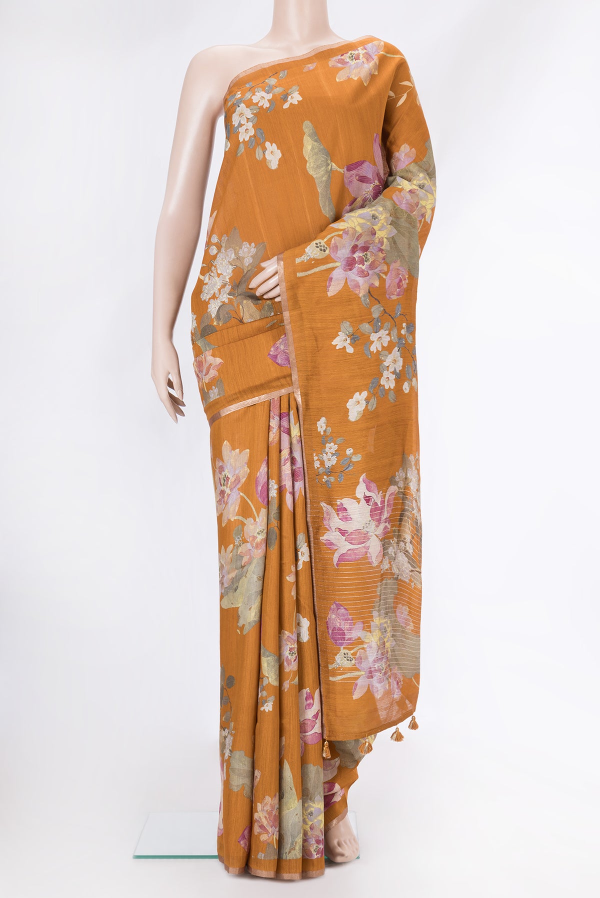 Mustard Tussar Silk Saree with Printed design on the body and Zari Border.  displayed on a mannequin