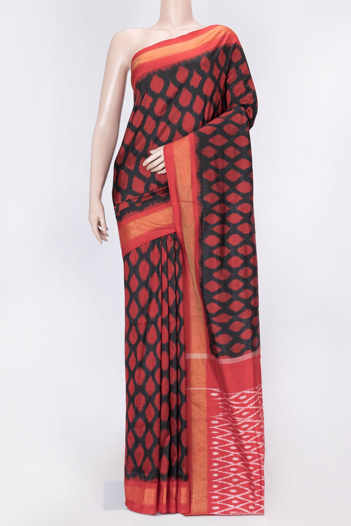 Black Dual Tone Double Ikat Saree with Ikat Print on the body and Zari Border displayed on a mannequin