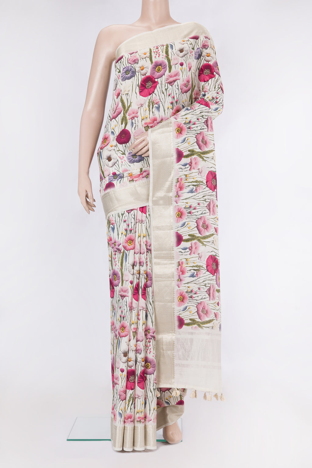 Off White Tussar Silk Saree with Printed design on the body and Zari Border.  displayed on a mannequin