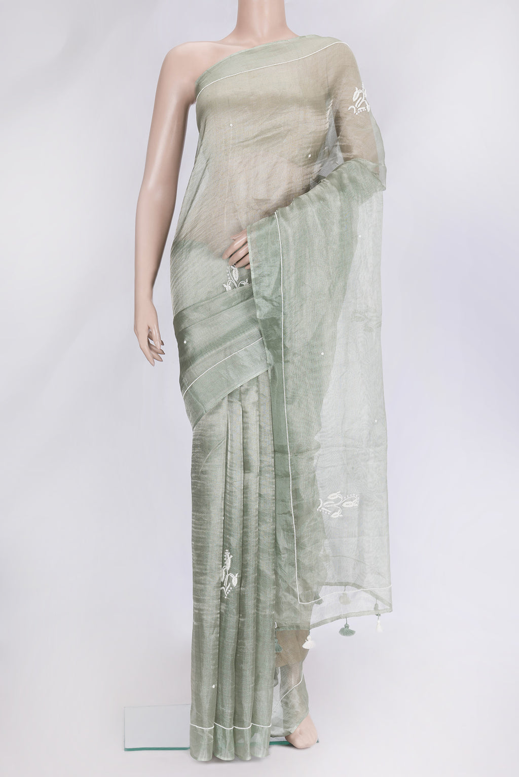Pista Green Dual Tone Organza Silk Saree with Embroidery on the body and Embroidery Border.  displayed on a mannequin