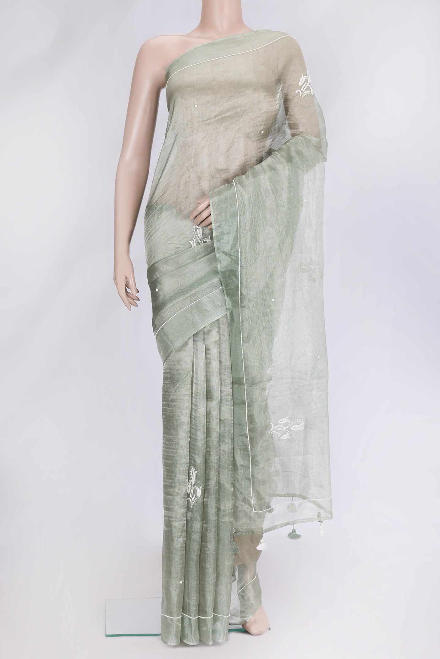 Pista Green Dual Tone Organza Silk Saree with Embroidery on the body and Embroidery Border.  displayed on a mannequin
