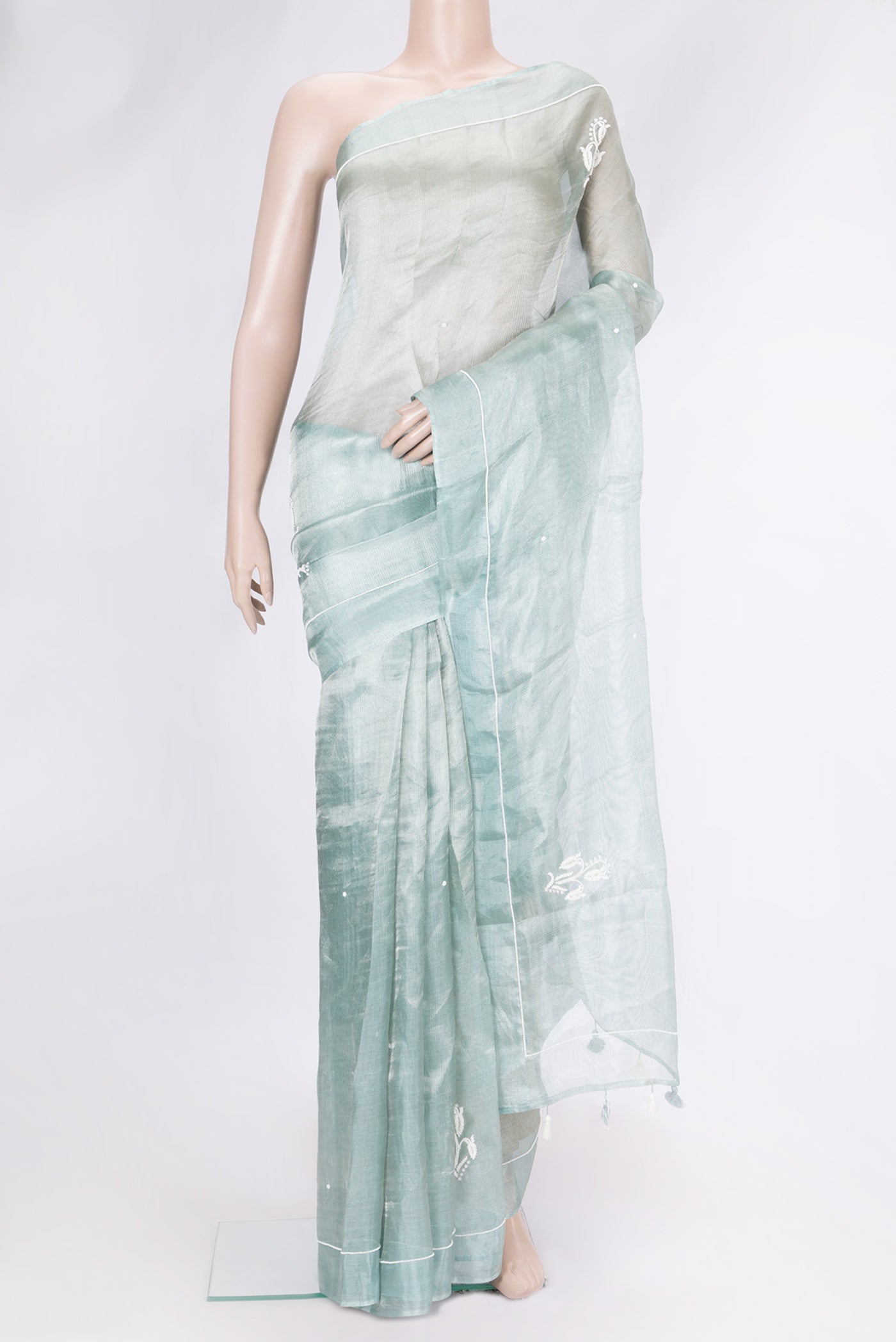 Light Green Dual Tone Organza Silk Saree with Embroidery on the body and Embroidery Border.  displayed on a mannequin