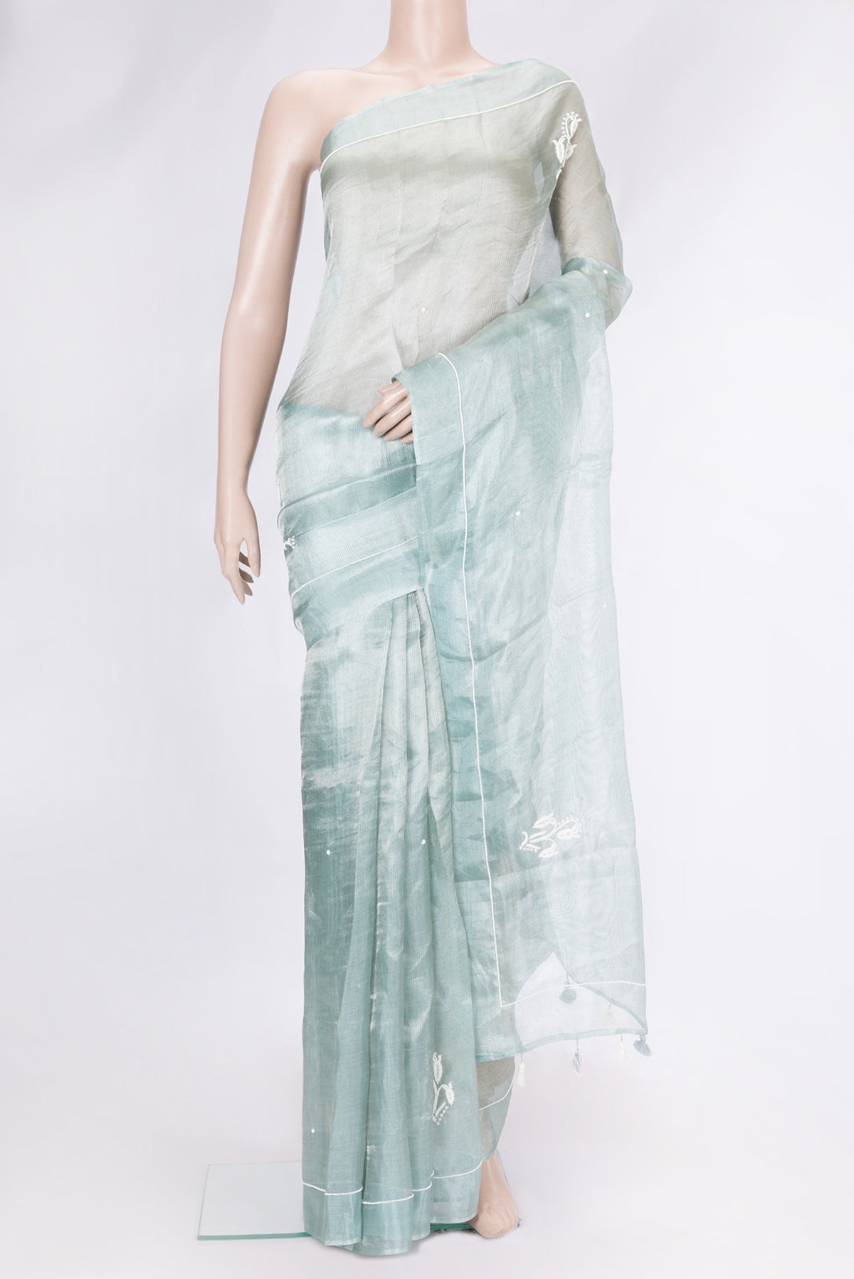 Light Green Dual Tone Organza Silk Saree with Embroidery on the body and Embroidery Border.  displayed on a mannequin