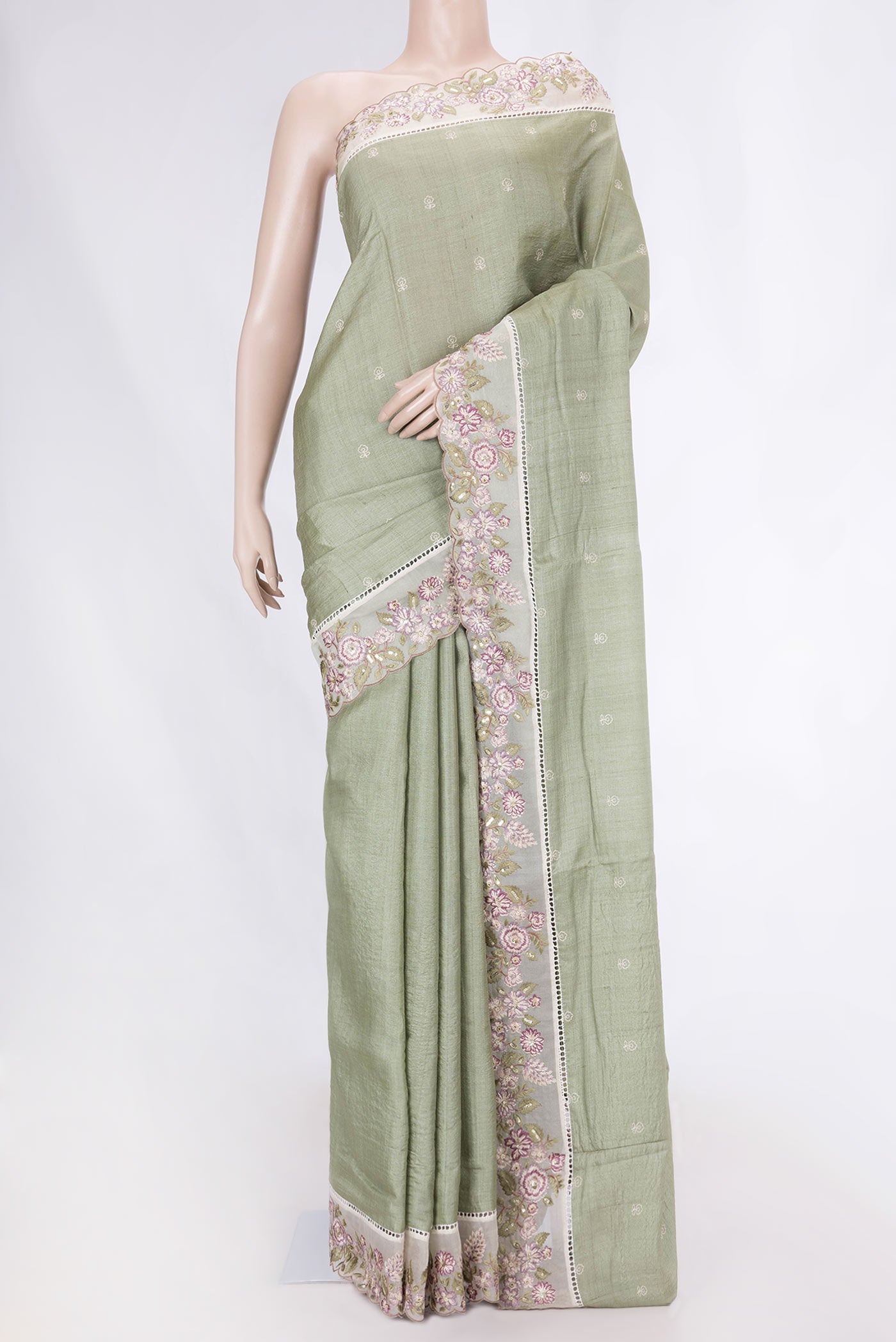 Sage Green Tussar Silk Saree with Embroidery on the body and Embroidery Border displayed on a mannequin