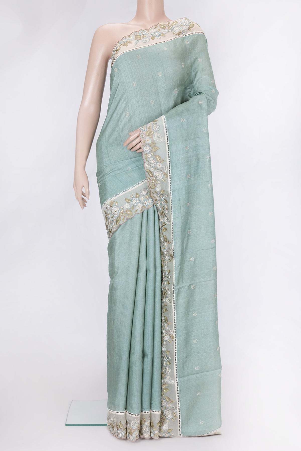 Pista Green Dual Tone Tussar Silk Saree with Embroidery on the body and Embroidery Border.  displayed on a mannequin