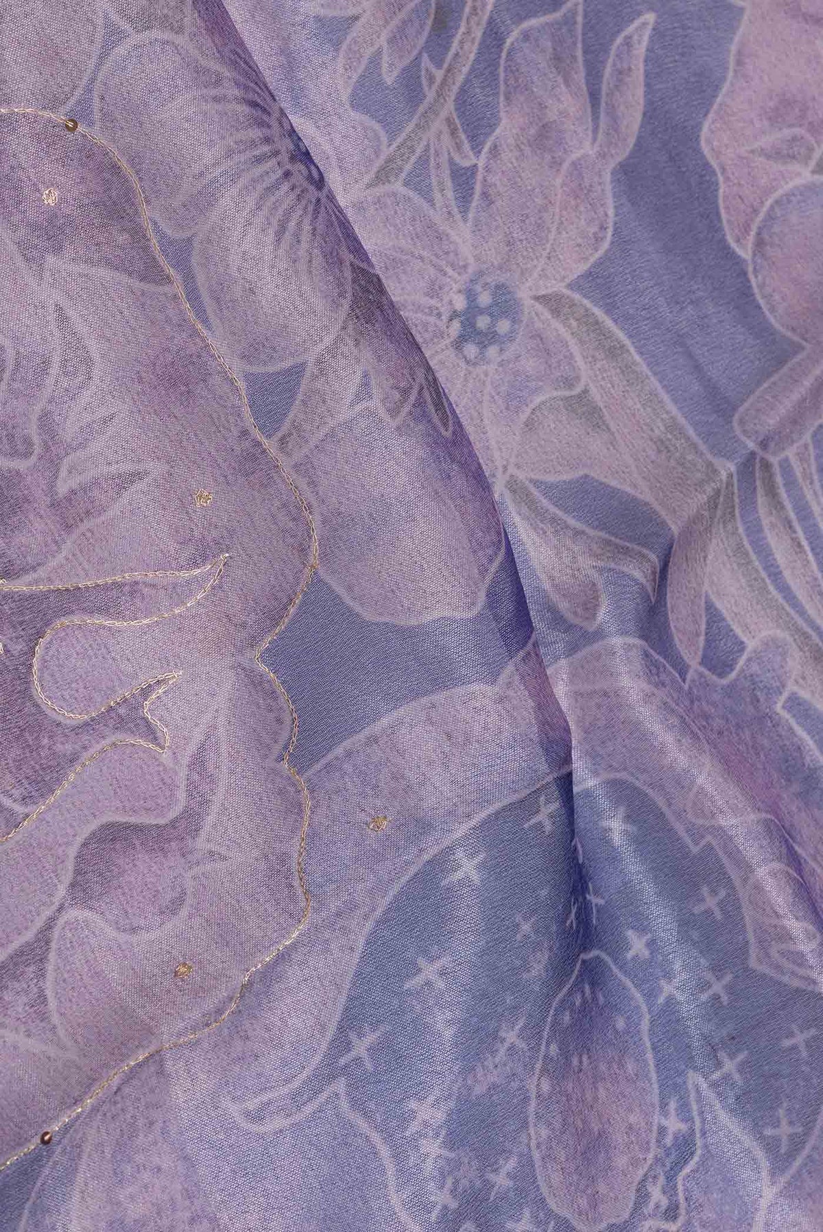 Close up of Lavender Dual Tone Organza Silk Saree with Embroidery on the body and Embroidery Border displaying folds