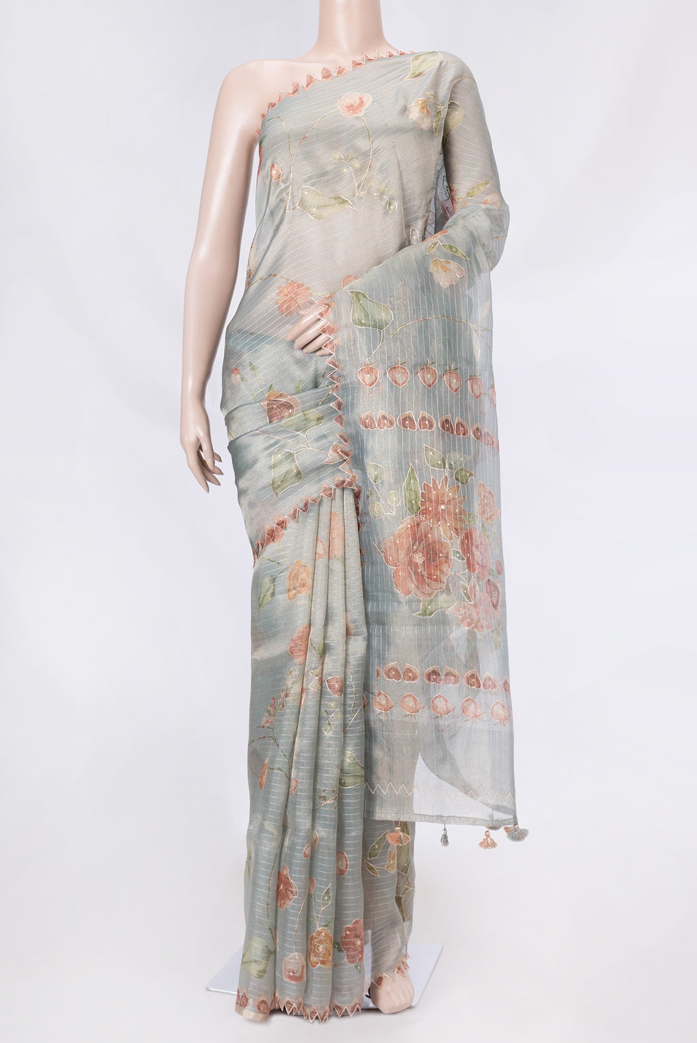 Blue Grey Organza Silk Saree with Embroidery on the body and Embroidery Border displayed on a mannequin