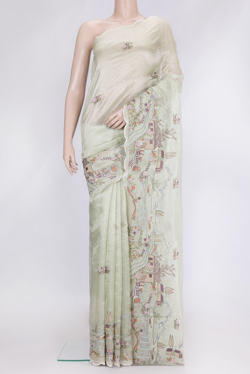 Pista Green Dual Tone Organza Silk Saree with Embroidery on the body and Embroidery Border.  displayed on a mannequin