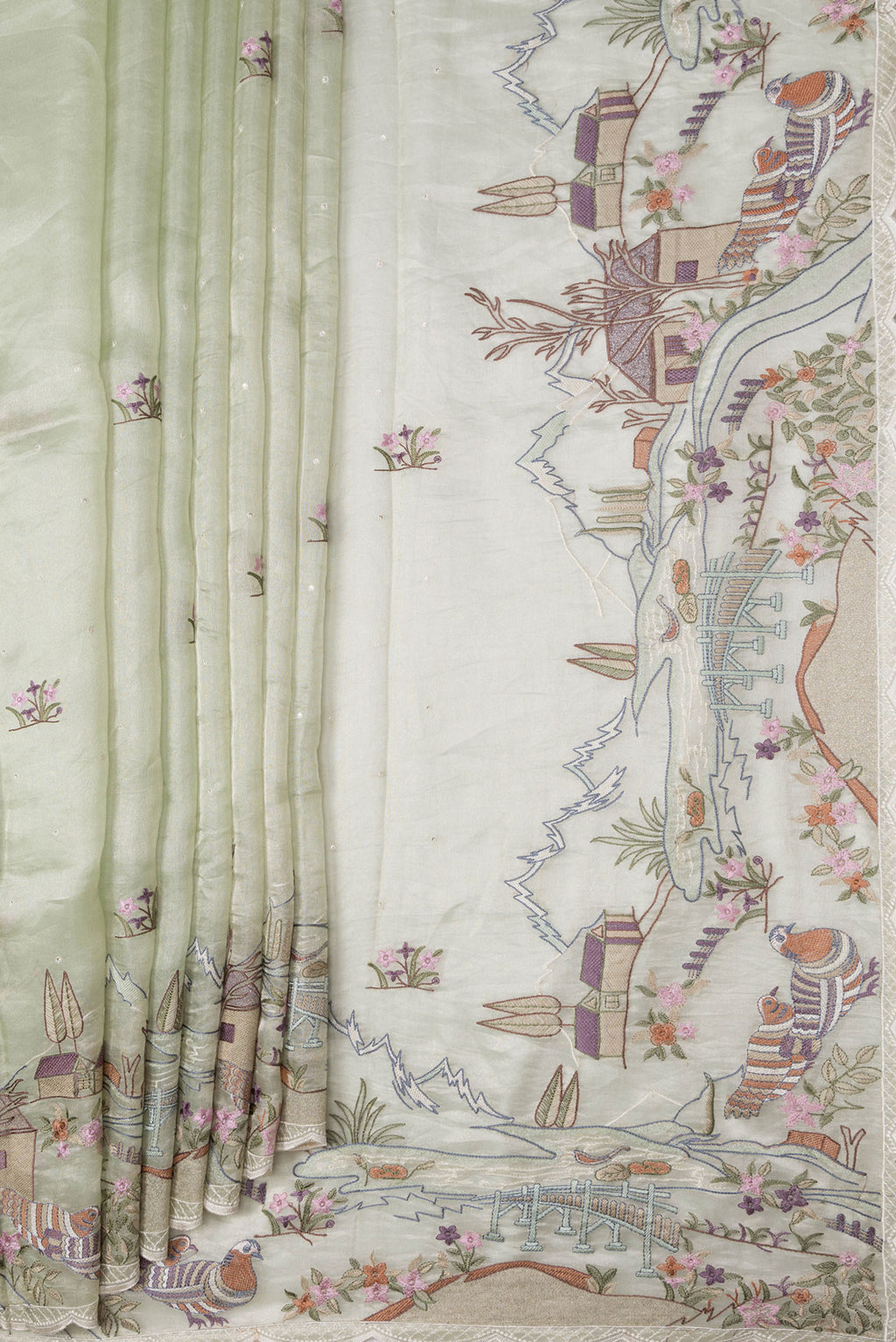 Pleats and pallu of Pista Green Dual Tone Organza Silk Saree with Embroidery on the body and Embroidery Border. 