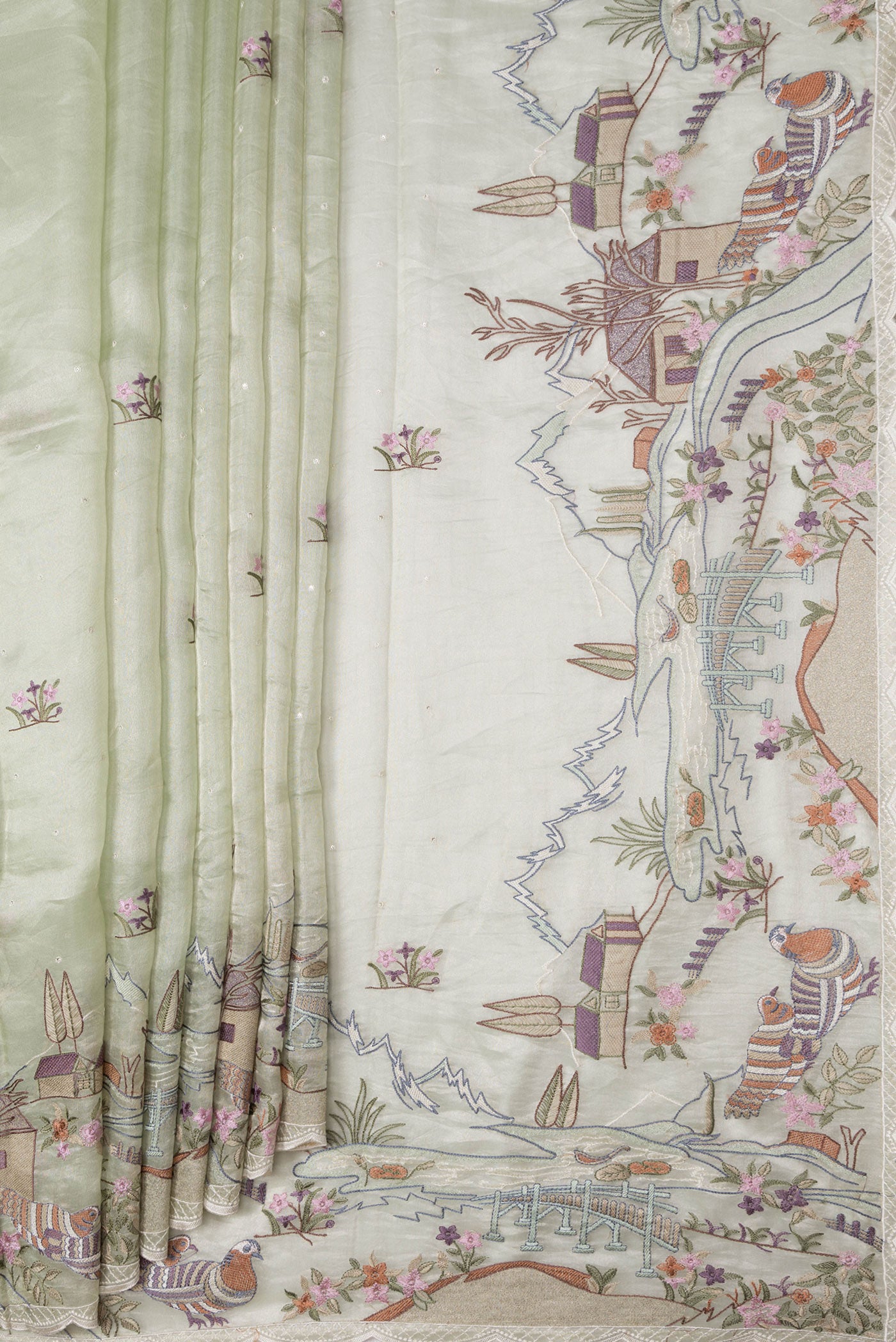 Pleats and pallu of Pista Green Dual Tone Organza Silk Saree with Embroidery on the body and Embroidery Border. 