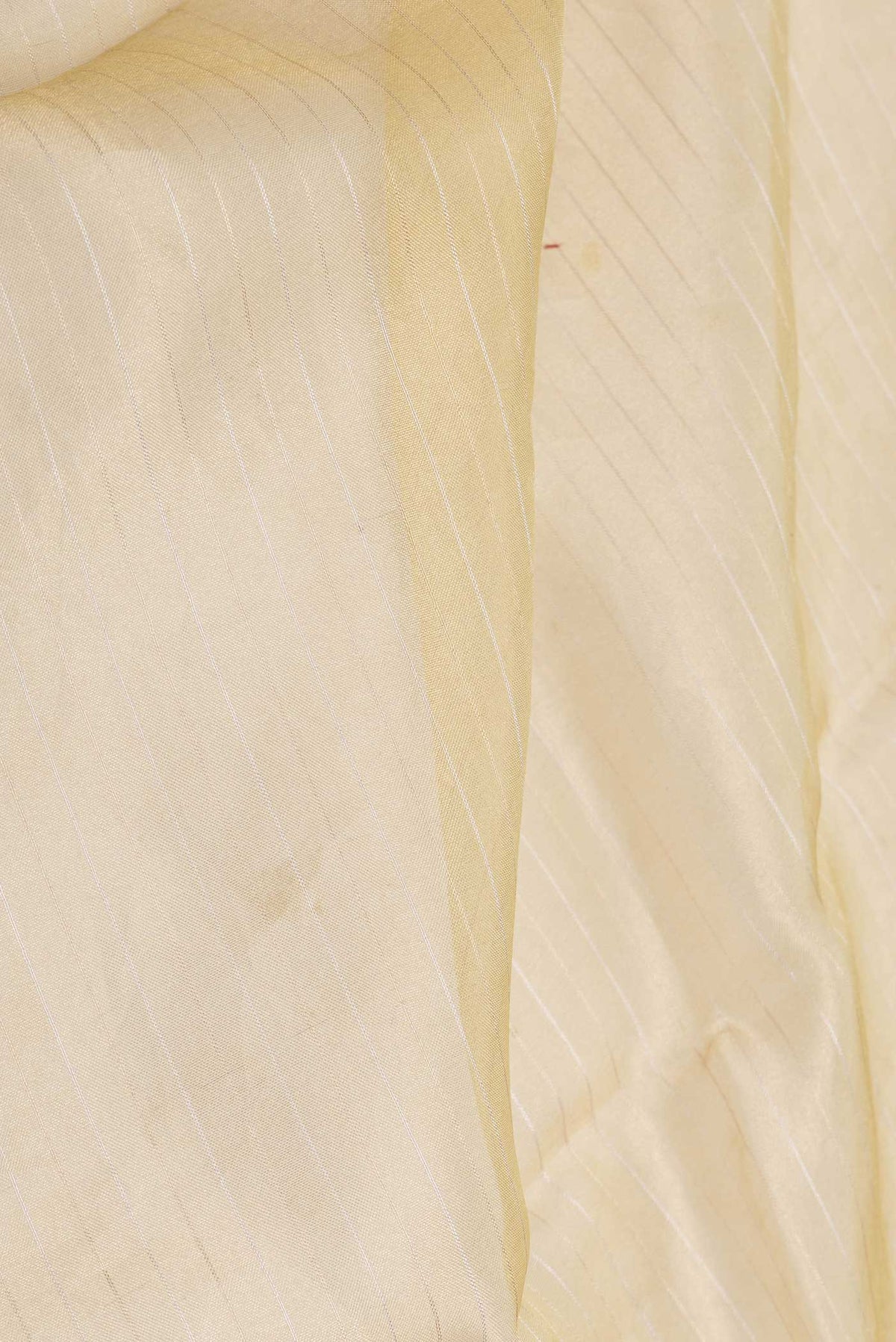 Close up of Sandal Dual Tone Organza Silk Saree with Stripes on the body and Embroidery Border displaying folds