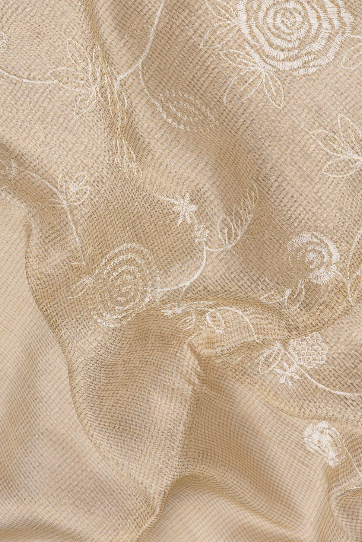 Close up of Sandal Dual Tone Tussar Silk Saree with Embroidery on the body and Zari Border.  displaying folds
