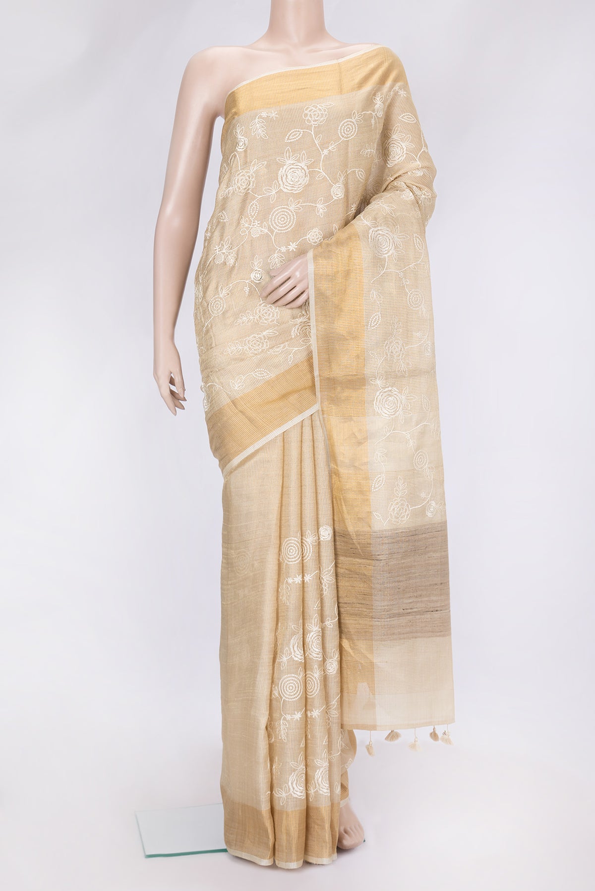 Sandal Dual Tone Tussar Silk Saree with Embroidery on the body and Zari Border.  displayed on a mannequin