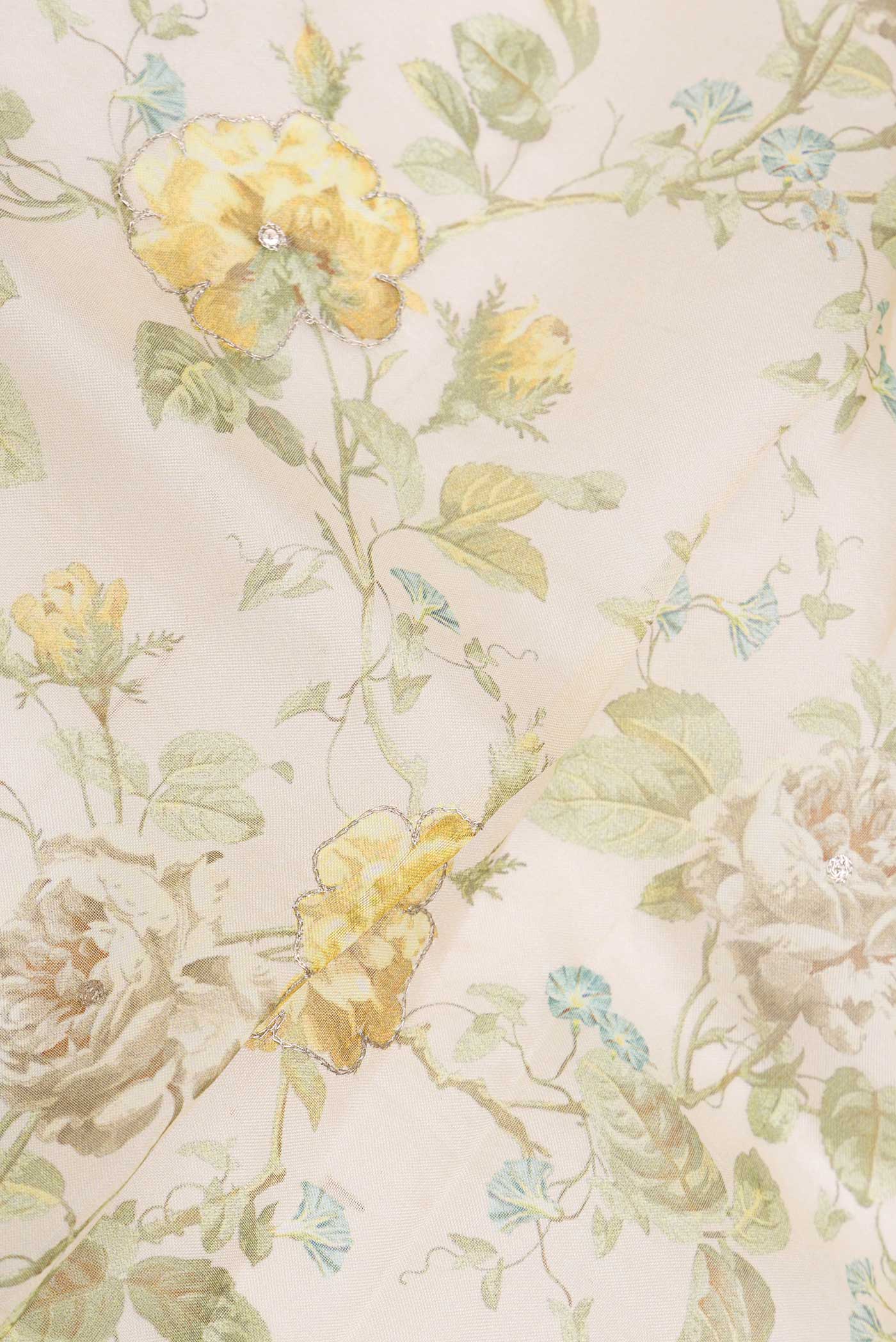 Close up of Cream Organza Silk Saree with Floral Print on the body and Embroidery Border displaying folds
