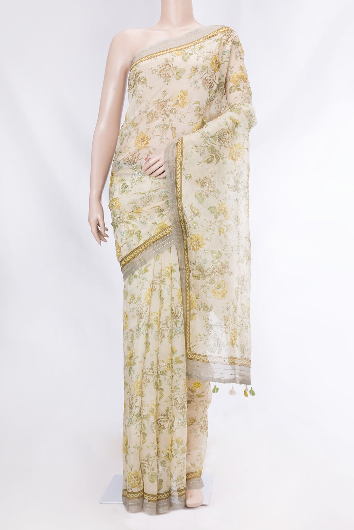 Cream Organza Silk Saree with Floral Print on the body and Embroidery Border displayed on a mannequin