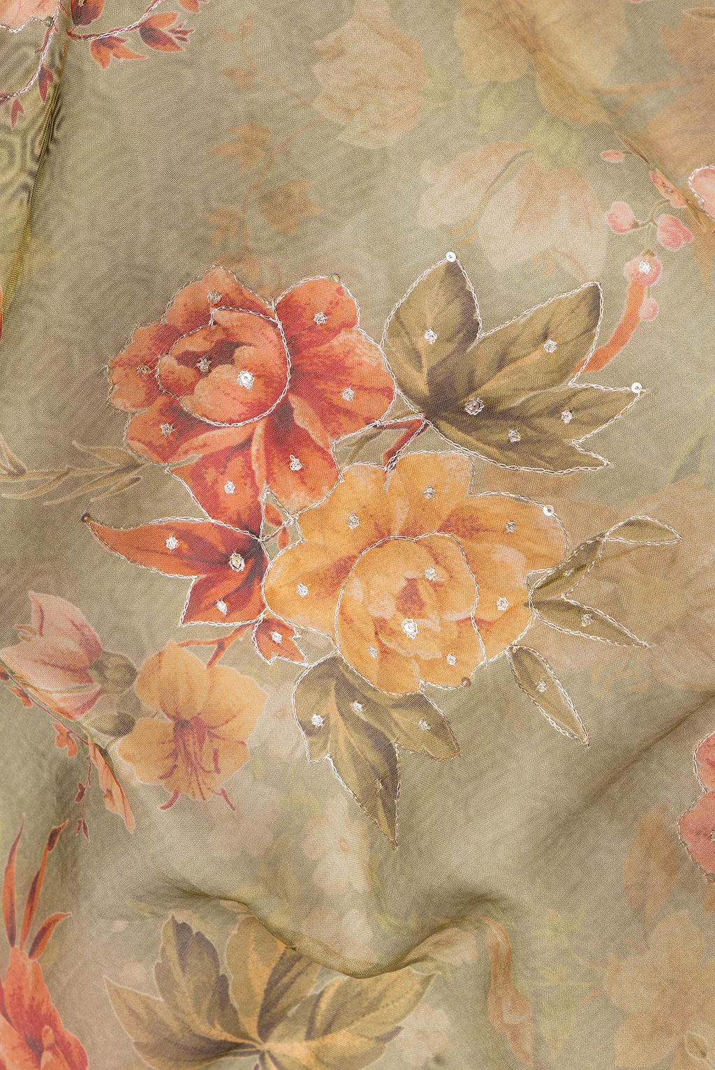 Close up of Pista Green Dual Tone Organza Silk Saree with Embroidery on the body and Embroidery Border.  displaying folds