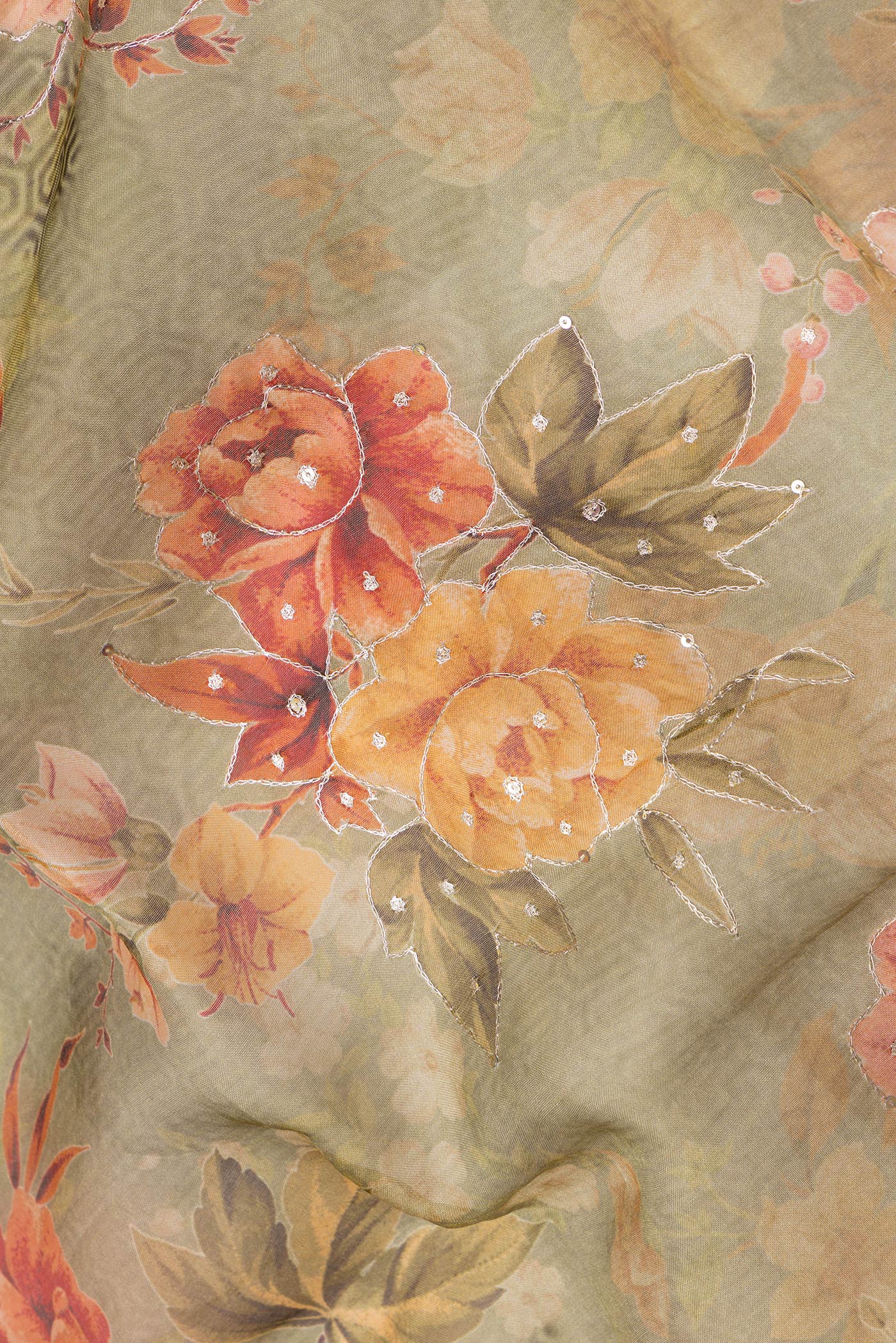 Close up of Pista Green Dual Tone Organza Silk Saree with Embroidery on the body and Embroidery Border.  displaying folds