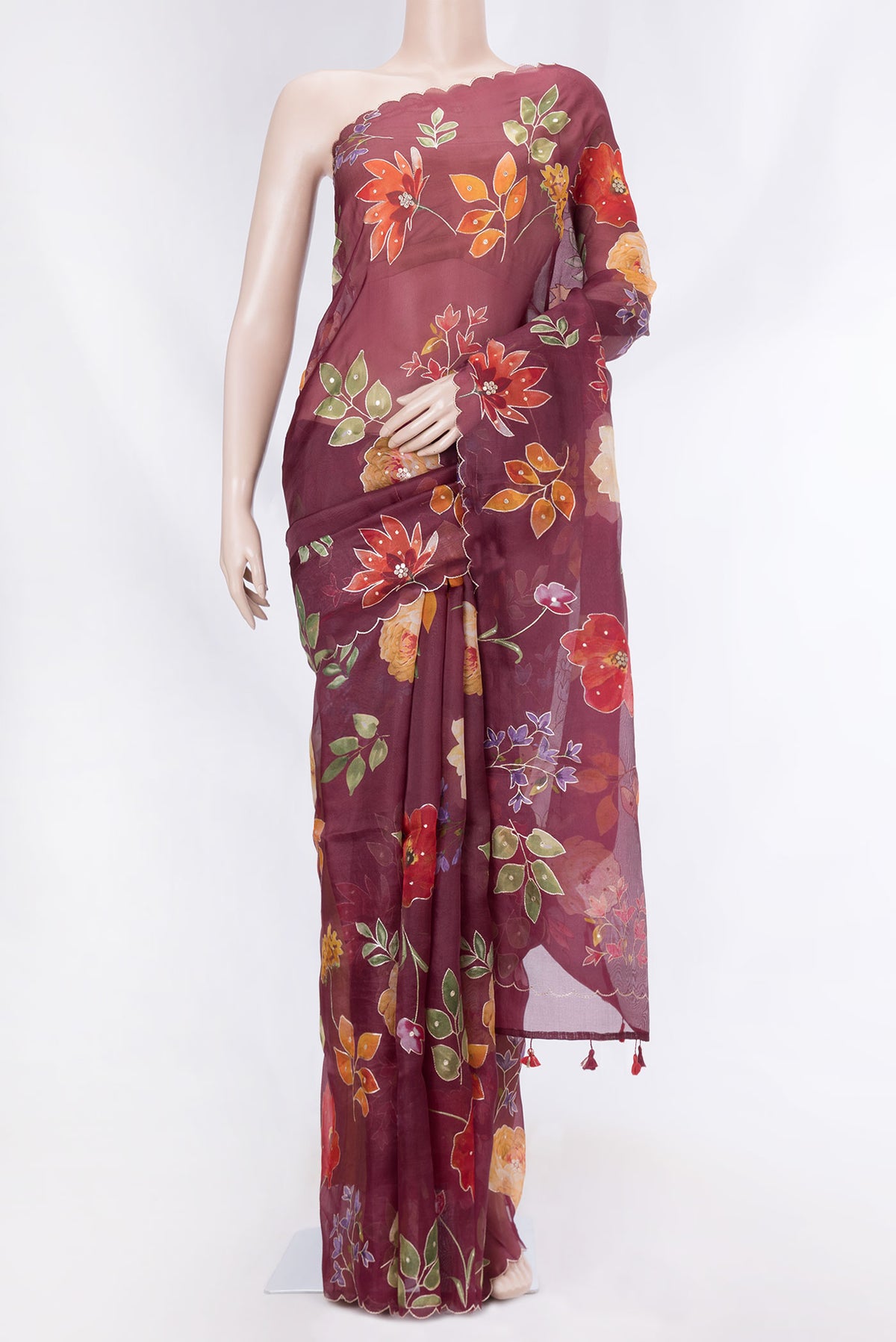 Maroon Dual Tone Organza Silk Saree with Printed design on the body and Embroidery Border displayed on a mannequin